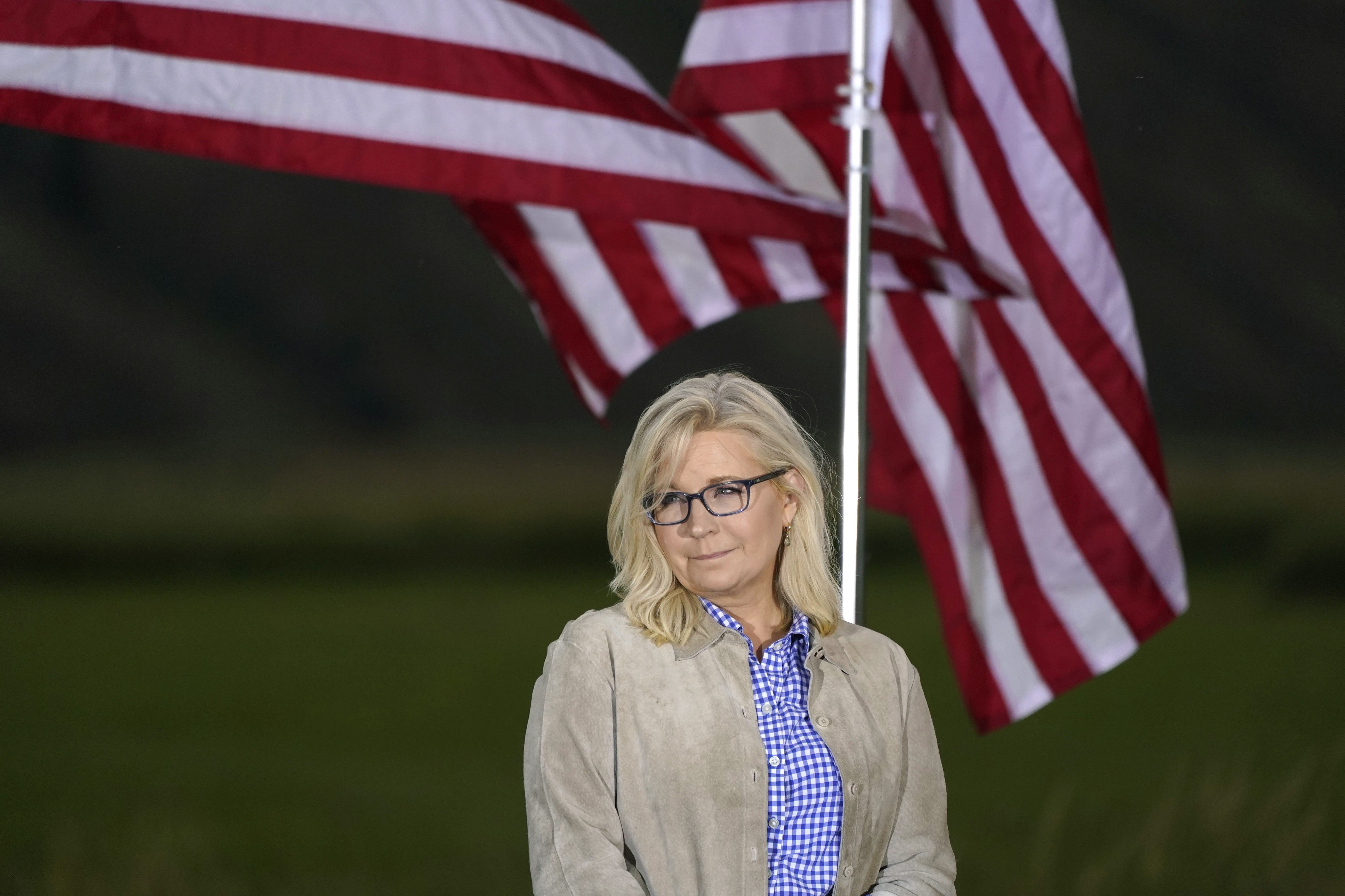 Rep. Liz Cheney, R-Wyo., waits by flags before speaking, Tuesday, at an Election Day gathering in Jackson, Wyo. Harriet Hageman has won the Republican nomination for U.S. House in Wyoming's at-large Congressional District, beating Cheney.