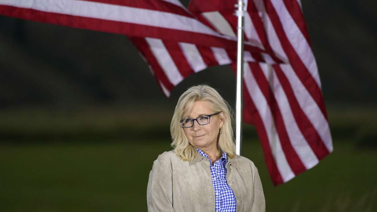 Rep. Liz Cheney, R-Wyo., waits by flags before speaking, Tuesday, at an Election Day gathering in Jackson, Wyo. Harriet Hageman has won the Republican nomination for U.S. House in Wyoming's at-large Congressional District, beating Cheney.