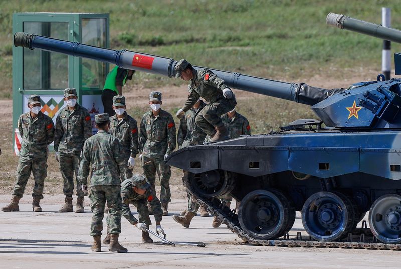 Members of China's team operate with their Type 96A tank during the Tank Biathlon competition at the International Army Games 2022 in Alabino, outside Moscow, Russia, on Aug. 16. Chinese troops will travel to Russia to take part in joint military exercises led by the host and including India, Belarus, Mongolia, Tajikistan and other countries, China's defense ministry said on Wednesday.