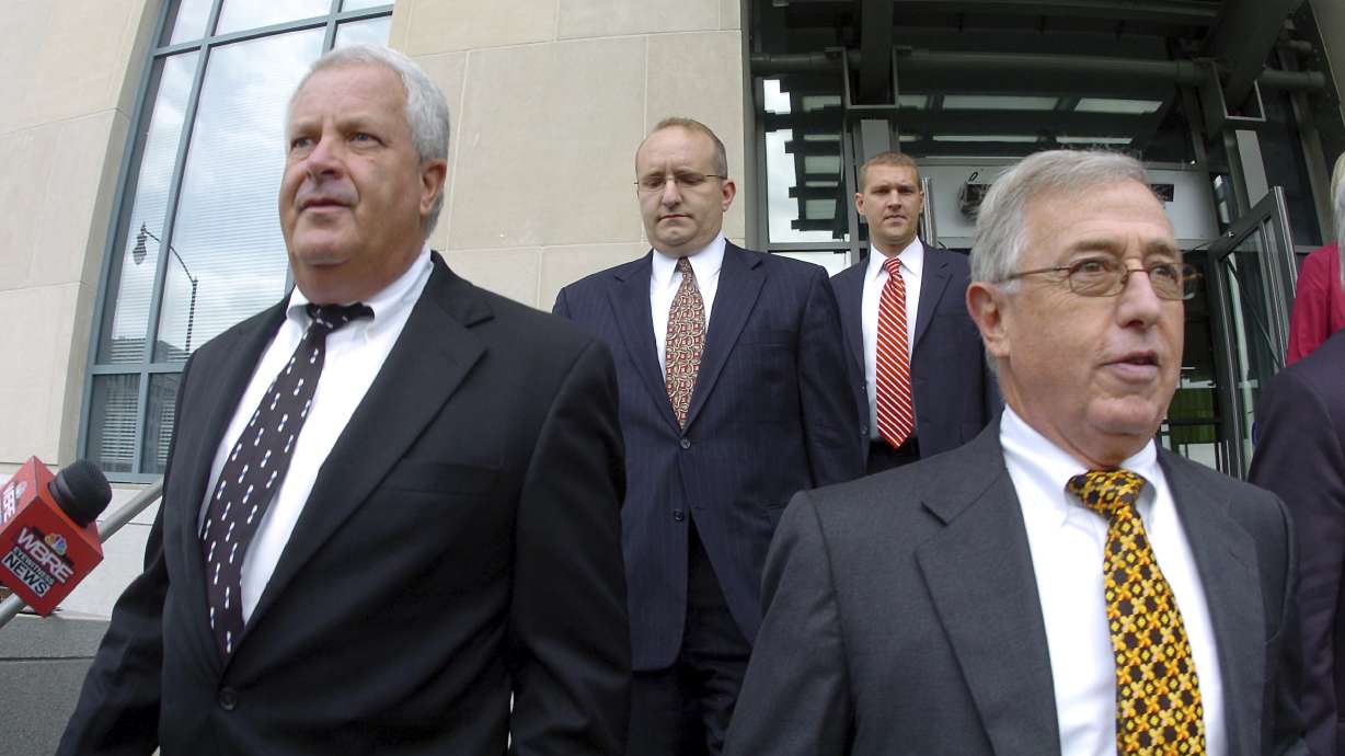 Former Luzerne County Court Judges Michael Conahan, front left, and Mark Ciavarella, front right, leave the courthouse in Scranton, Pa., on Sept., 15, 2009. The two Pennsylvania judges who orchestrated a scheme to send children to for-profit jails in exchange for kickbacks were ordered to pay more than $200 million.