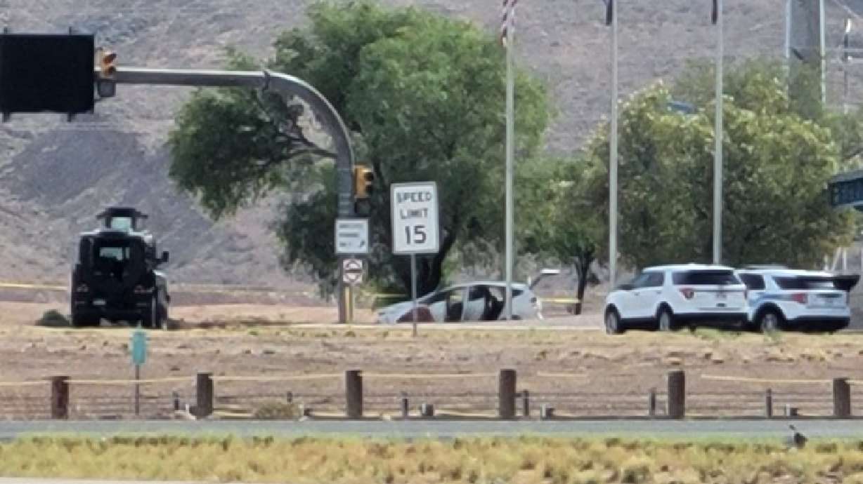 St.George Police conduct an investigation around a passenger vehicle after shots were heard at the northbound I-15 Port of Entry, St. George on Aug. 3.