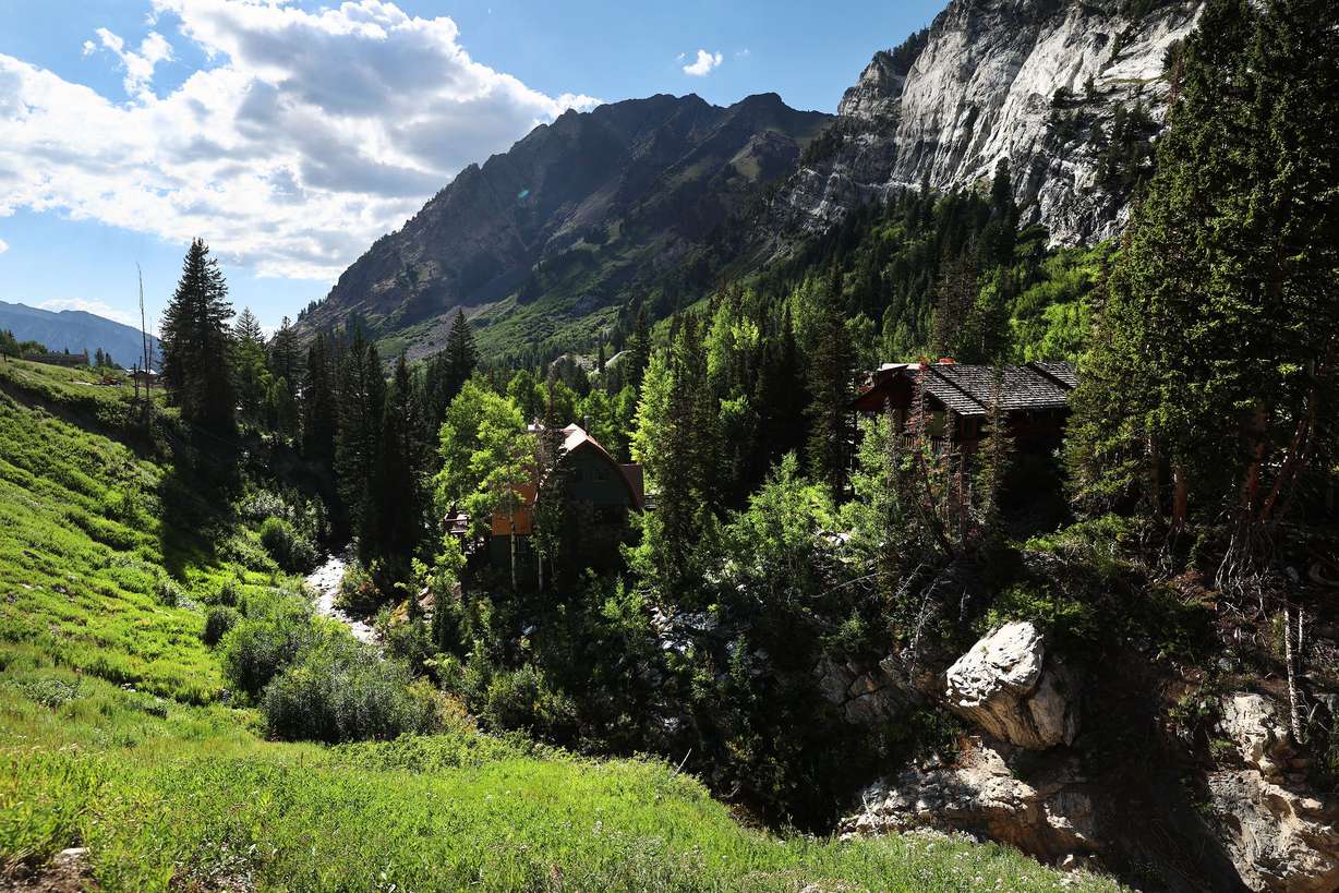 Water runs down Little Cottonwood Creek near homes in Little Cottonwood Canyon on Tuesday.