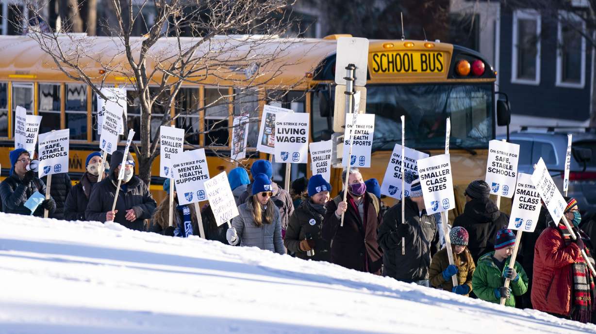 Dozens of striking educators picket outside Justice Page Middle School in Minneapolis, March 8. A decision that white educators in the area would be laid off ahead of less-senior minority faculty to remedy “past discrimination” has met with pushback.