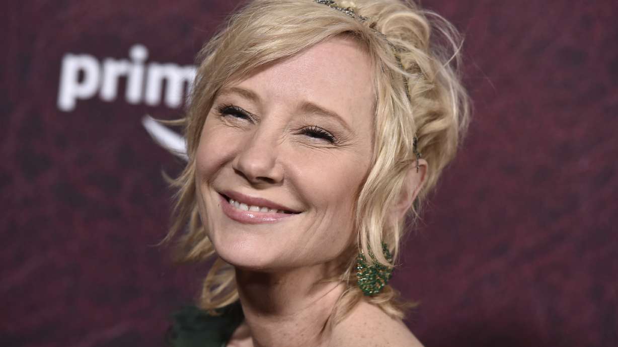 Anne Heche arrives at the premiere of "The Tender Bar" at the TCL Chinese Theatre, on Dec. 12, 2021, in Los Angeles. The coroner's office says actor Heche died from burns and inhalation injury after her fiery car crash and the death has been ruled an accident.