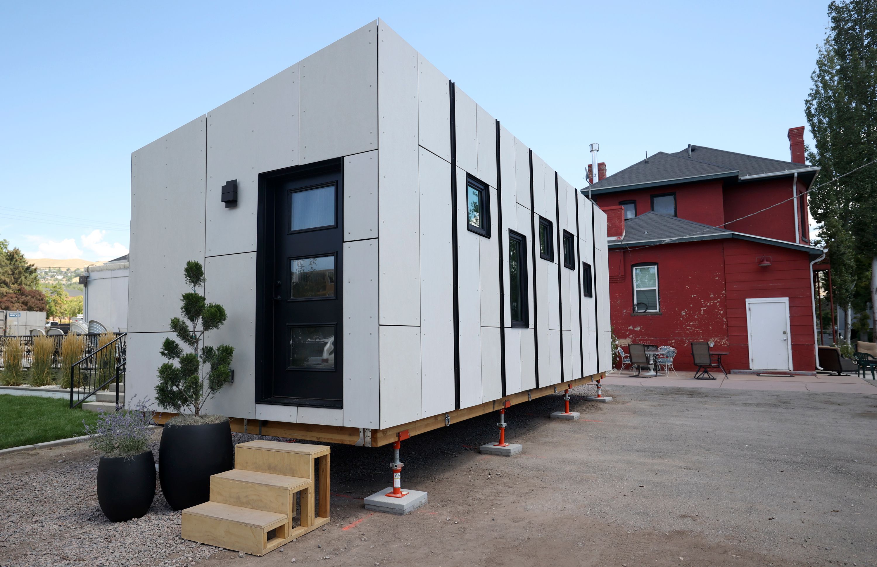 A 280-square-foot cottage that will be part of the Other Side Village, providing affordable, permanent housing for people coming out of chronic homelessness, is pictured in Salt Lake City on Aug. 16. It was designed and constructed as part of the University of Utah School of Architecture's Design + Build Salt Lake program. The first phase of the village will have 60 and eventually grow to 430 tiny homes.