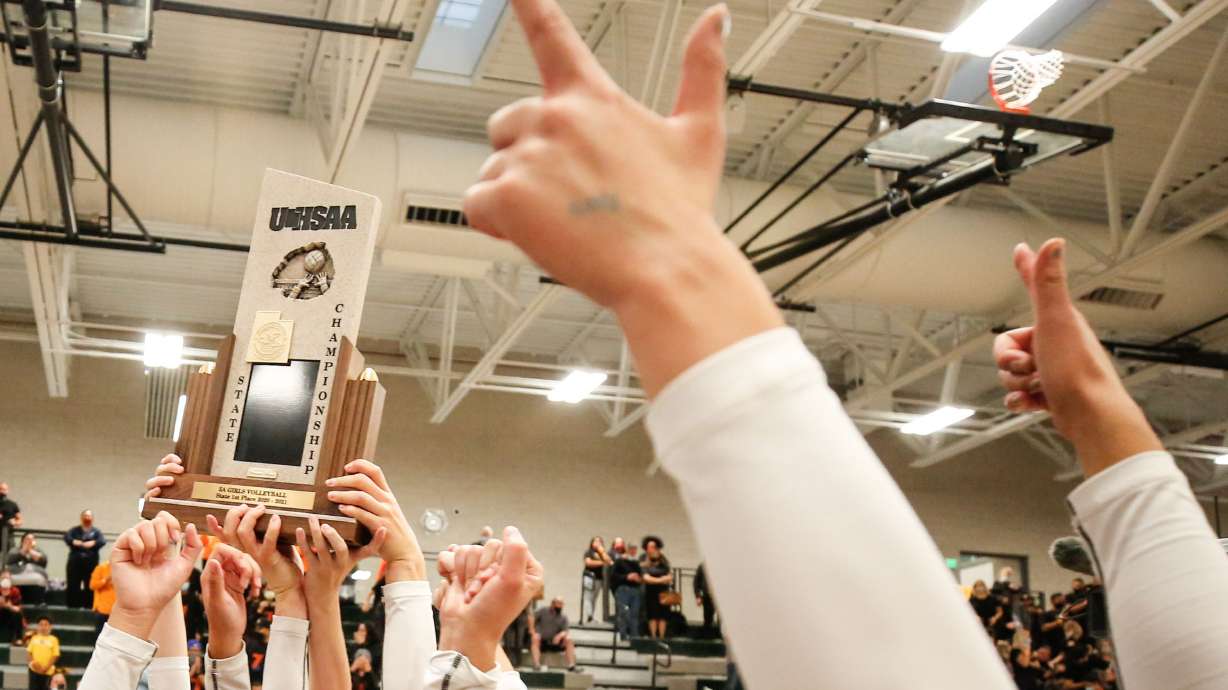 High school athletes hoist a UHSAA trophy in 2020. In the Utah Legislature’s Education Interim Committee on Wednesday, it was revealed that the UHSAA asked a student athlete’s school to investigate after parents called into question the gender of the winning competitor.