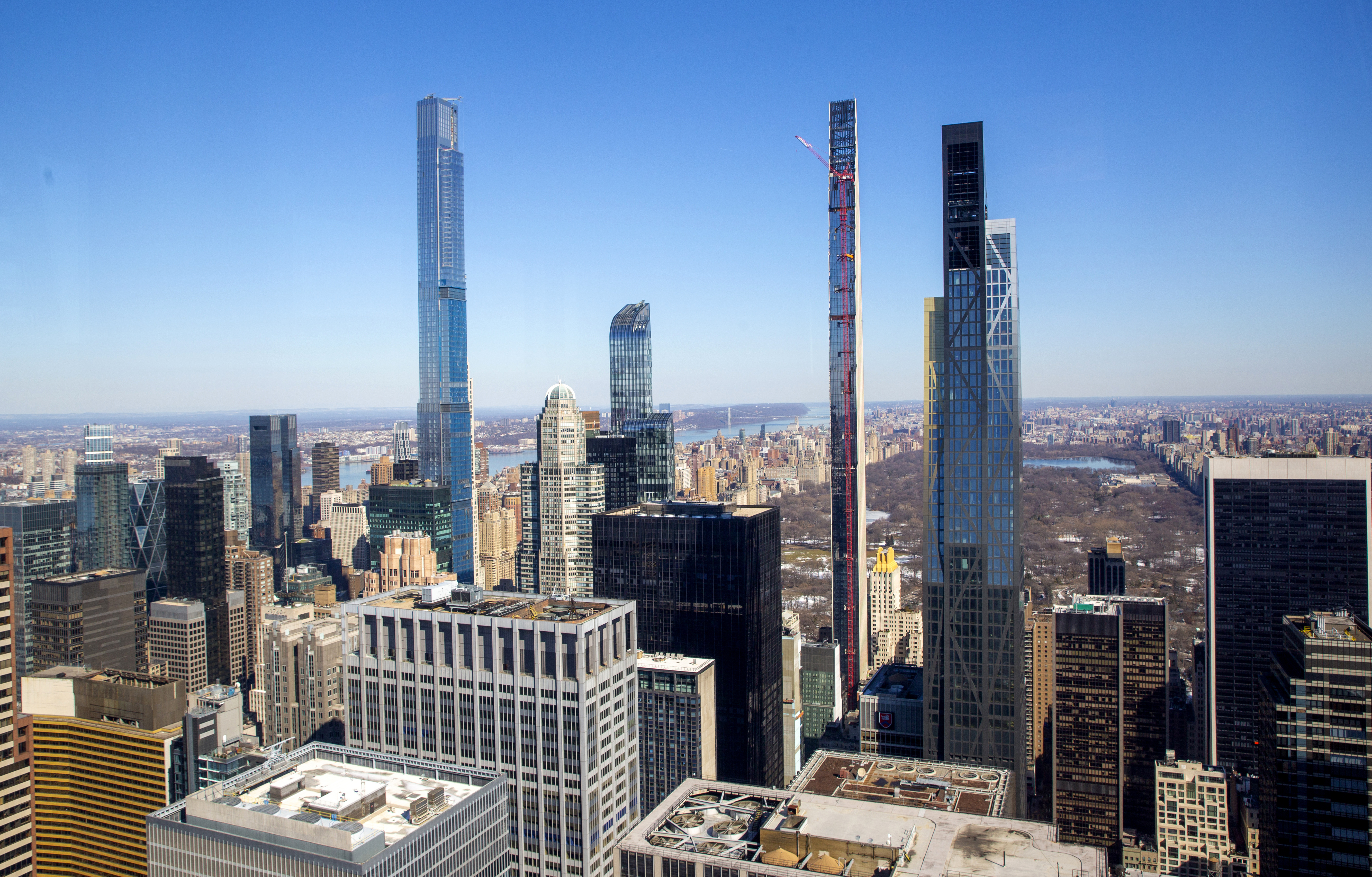 Four residential skyscrapers tower over the skyline south of Central Park in the Manhattan borough of New York City on Friday, Feb. 26, 2021. From left, Central Park Tower, One57, Steinway Tower and the MoMA Expansion Tower. 