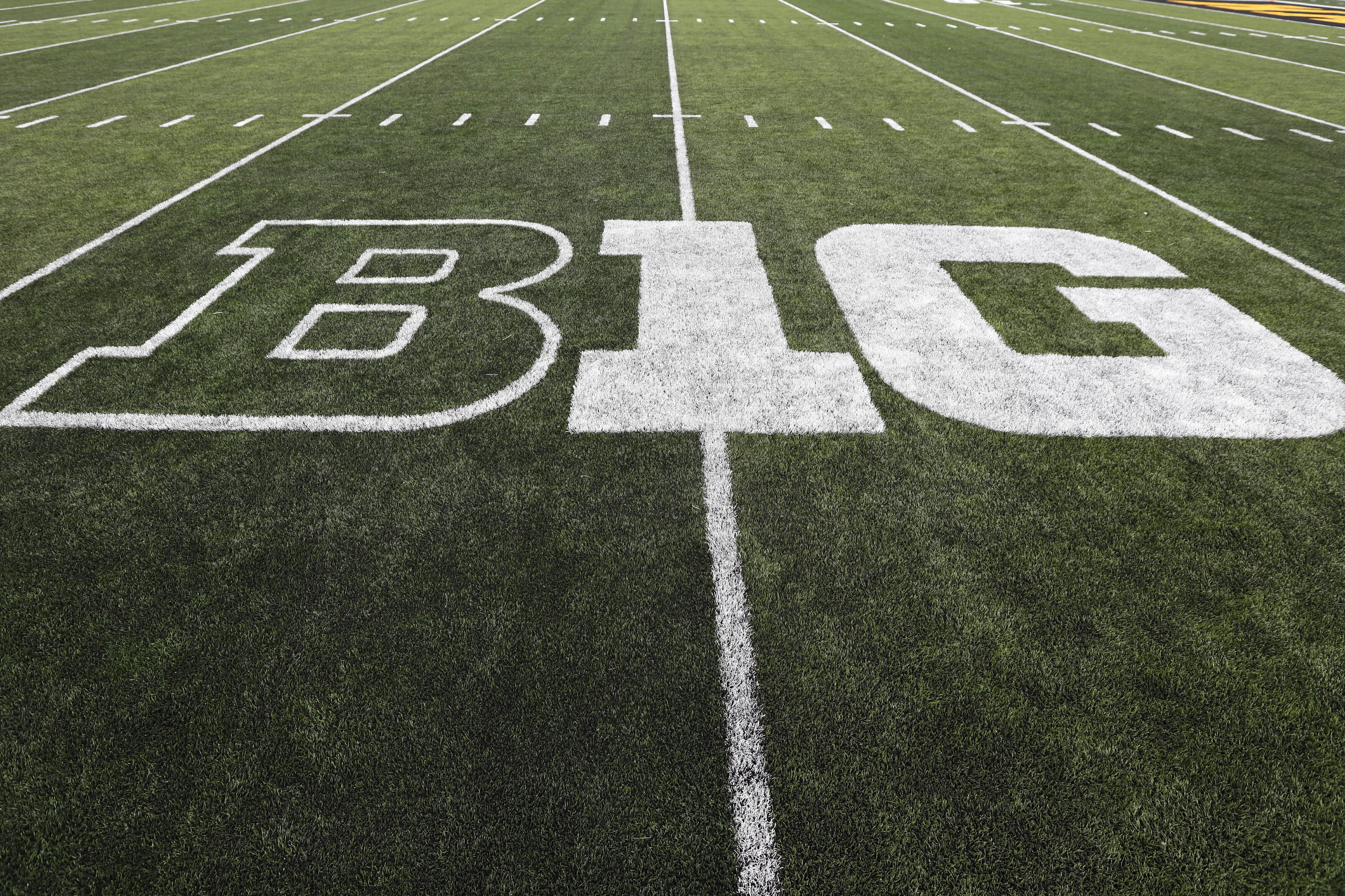 FILE - The Big Ten logo is displayed on the field before an NCAA college football game between Iowa and Miami of Ohio in Iowa City, Iowa., on Aug. 31, 2019. The Big Ten announced Thursday, Aug. 18, 2022, that it has reached seven-year agreements with Fox, CBS and NBC to share the rights to the conference's football and basketball games. 
