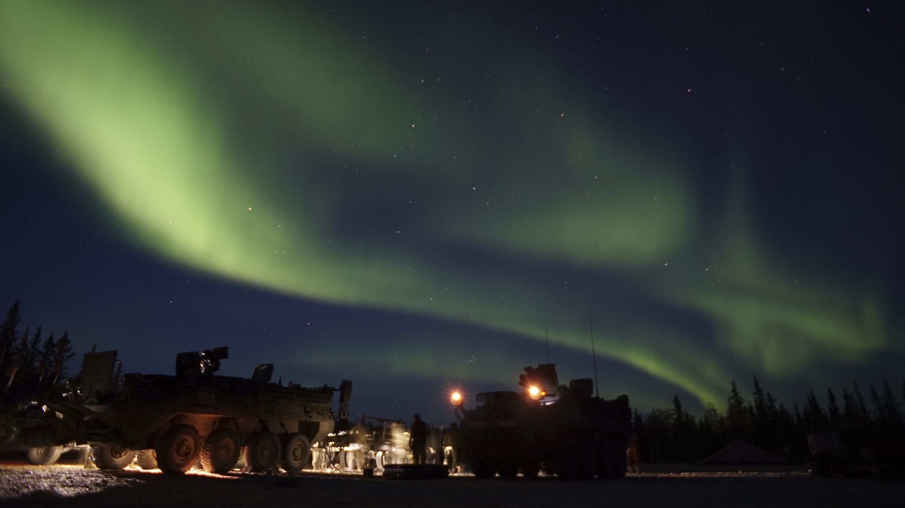 Soldiers based at Fort Wainwright, Alaska, conduct unscheduled field maintenance under the northern lights at Donnelly Training Area, near Fort Greely, Alaska, on Sept. 15, 2017. A strong geomagnetic storm may cause the northern lights to move south to be seen in different parts of the mainland United States.