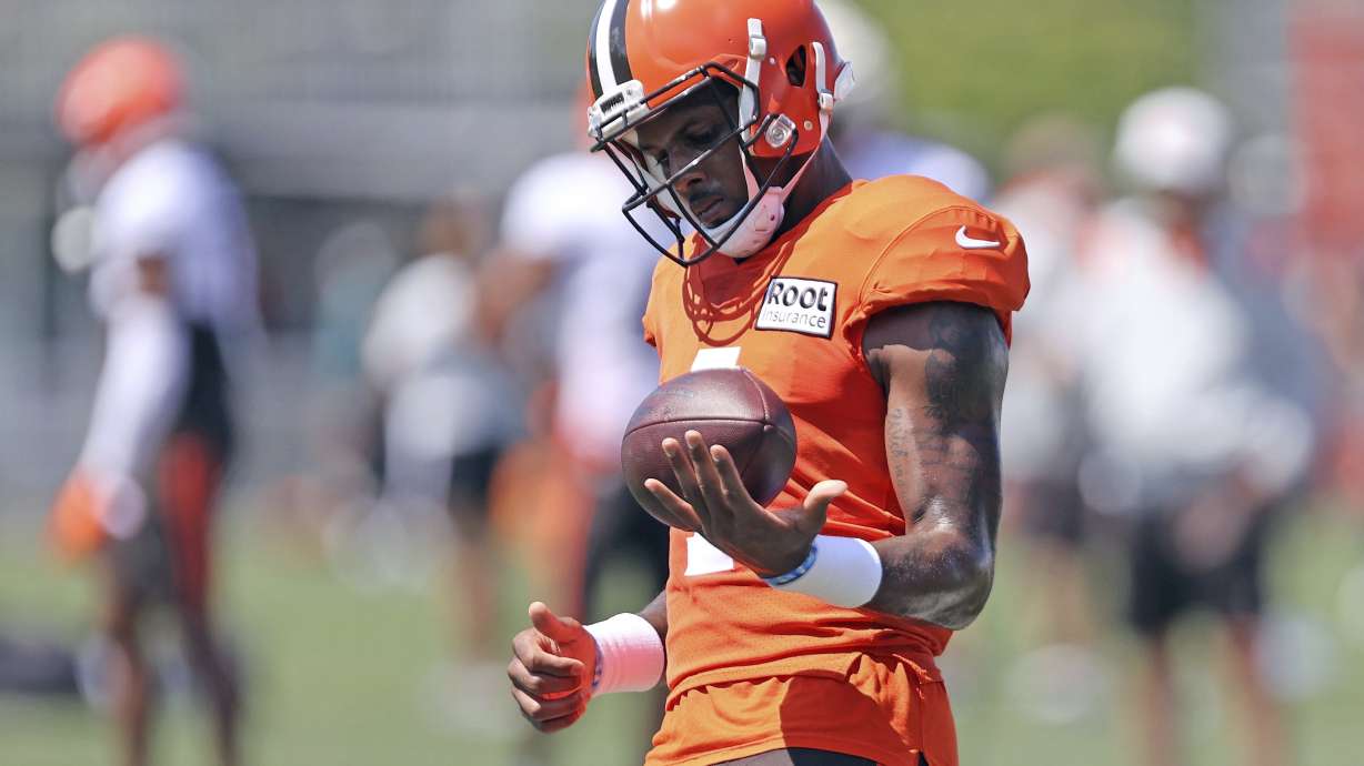 Cleveland Browns quarterback Deshaun Watson works out during a joint practice with the Philadelphia Eagles at NFL football training camp, Thursday, Aug. 18, 2022, in Berea, Ohio,. Watson has reached a settlement with the NFL and will serve an 11-game unpaid suspension and pay a $5 million fine rather than risk missing his first season as quarterback of the Cleveland Browns following accusations of sexual misconduct while he played for the Houston Texans.