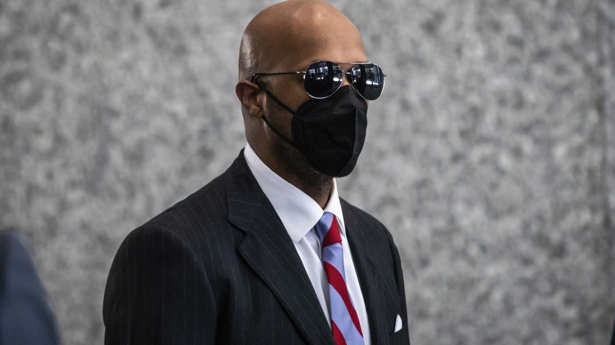 Milton "June" Brown walks walks into the Dirksen Federal Courthouse in Chicago as opening statements were expected to begin in R. Kelly's trial, Wednesday morning. Two Kelly associates, Derrel McDavid and Milton Brown, are co-defendants. McDavid is accused of helping Kelly fix the 2008 trial, while Brown is charged with receiving child pornography. Like Kelly, they also have denied wrongdoing.