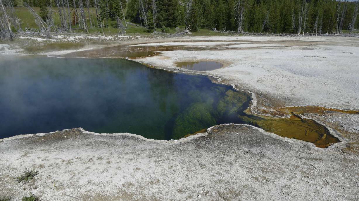 The Abyss Pool hot spring in the southern part of Yellowstone National Park, Wyo., in June 2015. Park officials say part of a foot, in a shoe, found floating in the hot spring on Tuesday, is related to a July 31 death.
