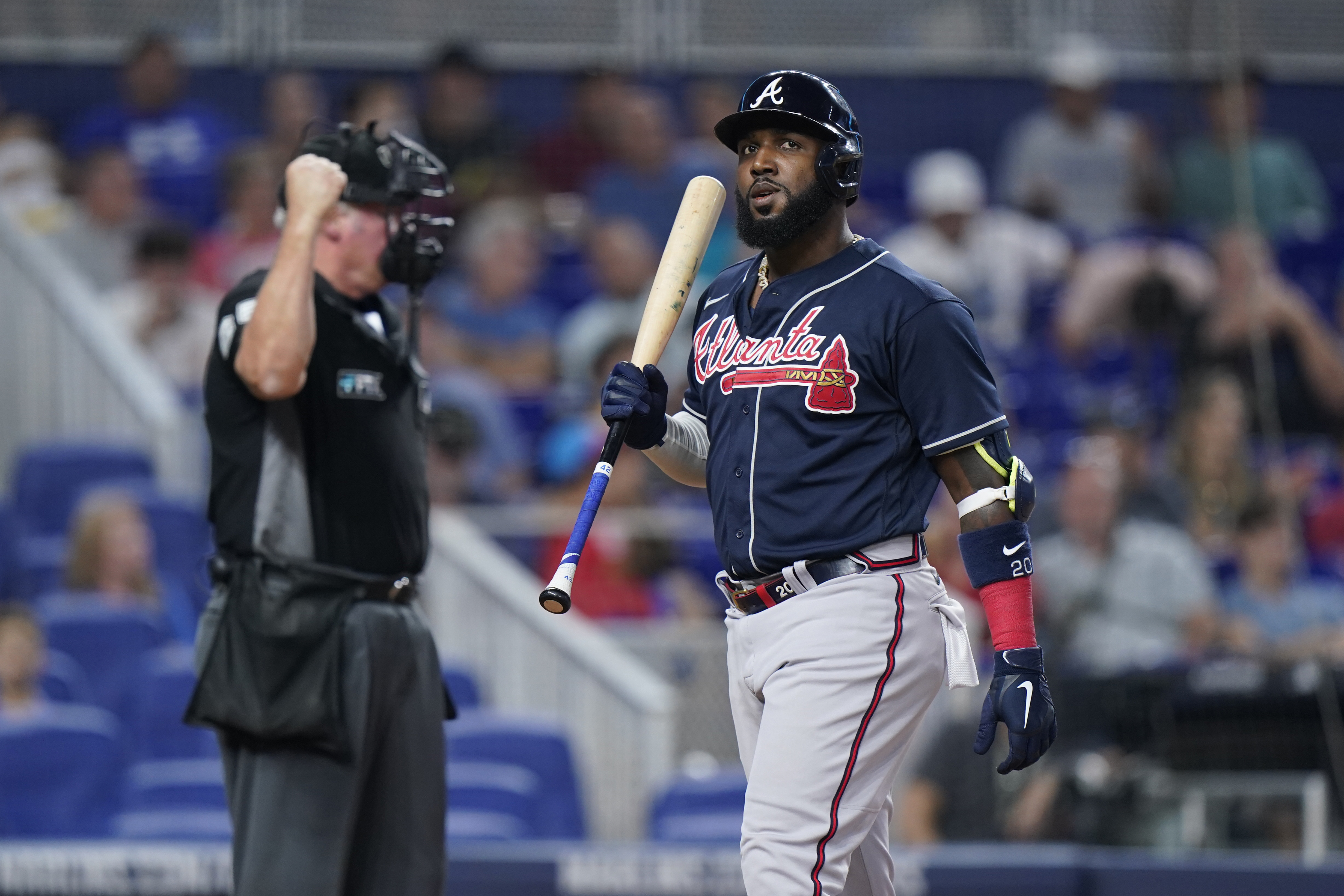 Atlanta Braves' Marcell Ozuna reacts after striking out during the seventh inning of a baseball game against the Miami Marlins, Sunday, Aug. 14, 2022, in Miami. 