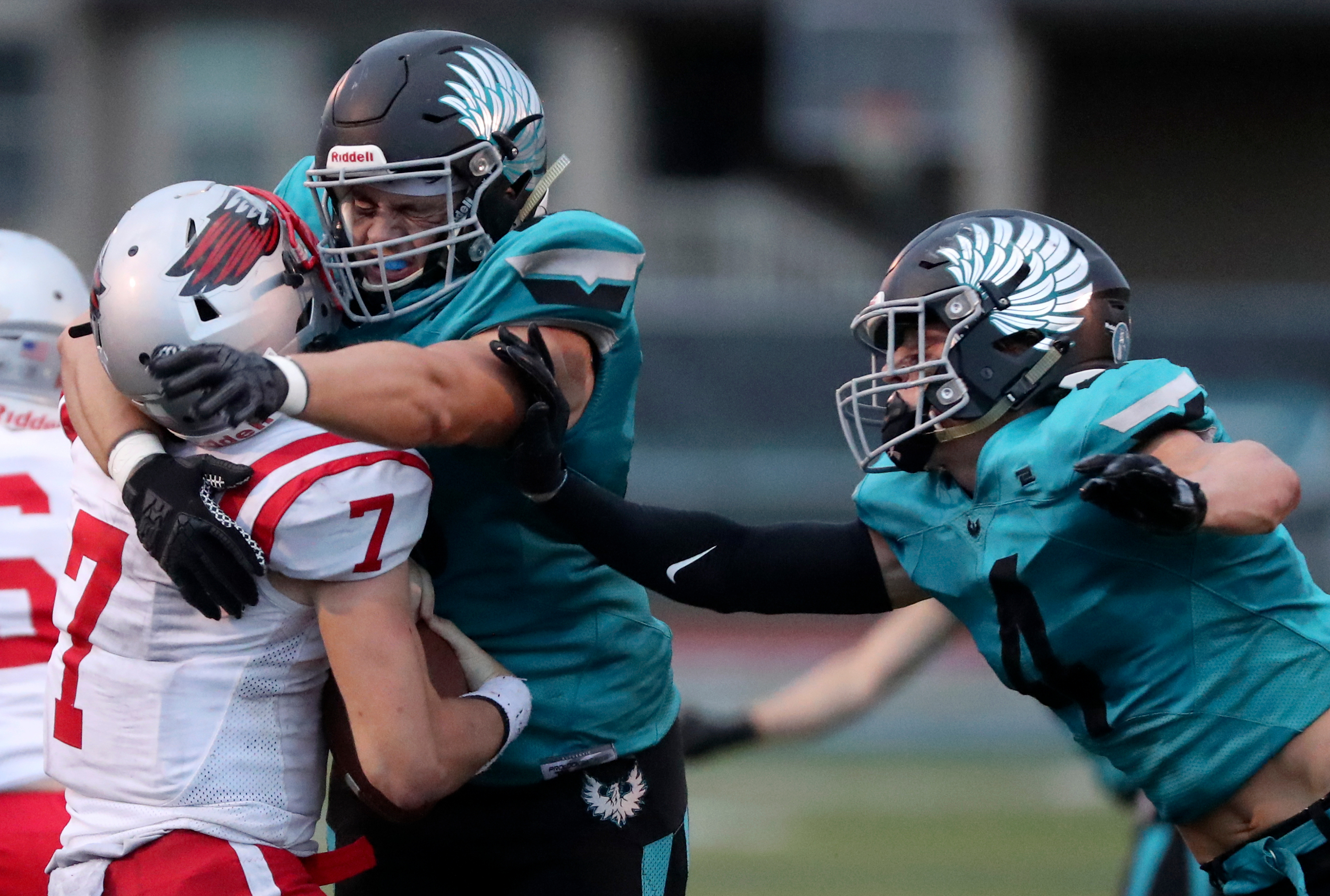 Farmington’s Ethan Briggs, center, and Luke Hansen sack Bountiful quarterback Owen Geilman during a varsity football game at Farmington High School in Farmington on Friday, Aug. 19, 2022. Farmington won 24-3.