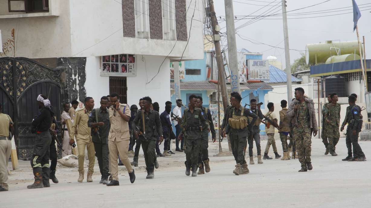 Soldiers patrol outside the Hayat Hotel in Mogadishu, Somalia, Saturday. At least 20 people were killed in an attack by Islamic militants who stormed the hotel in Somalia's capital late Friday, police and eyewitnesses said. Several other people were injured and security forces rescued many others, including children, from the scene of the attack at Mogadishu's Hayat Hotel.