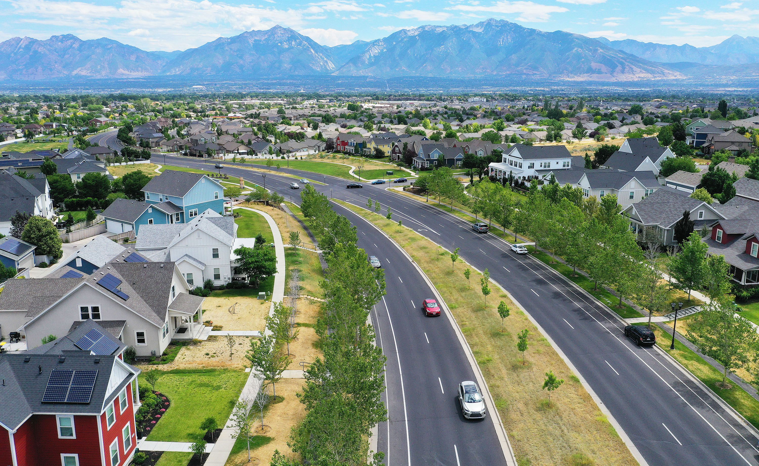 Motorists drive though Daybreak in South Jordan on July 13. July was an even more sluggish month for the U.S. housing market as sales of previously owned homes slipped by 6% from June and a whopping 20.2% year over year.