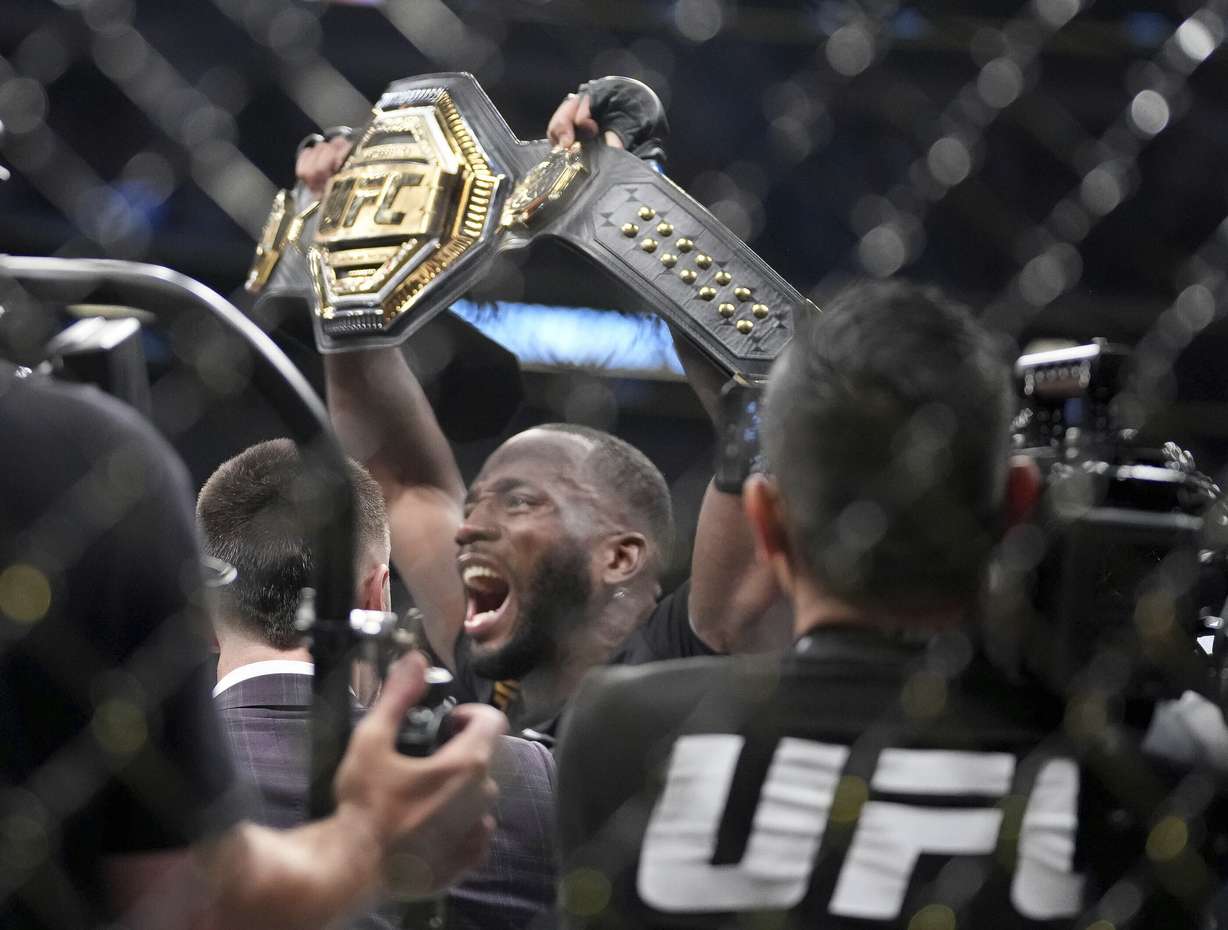 UFC fighter Leon Edwards, of Jamaica, celebrates his title as welterweight champion of the world after knocking out Nigerian UFC fighter Kamaru Usman during the UFC 278 mixed martial arts title bout in Salt Lake City on Saturday, Aug. 20, 2022.