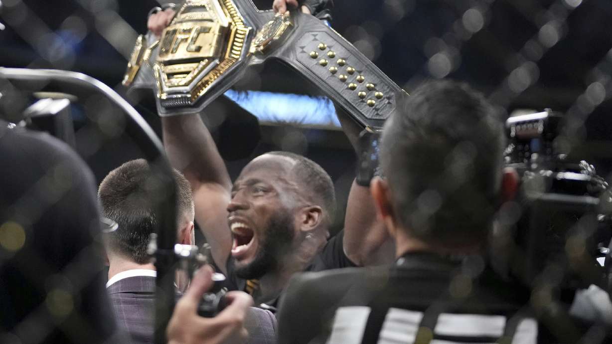 UFC fighter Leon Edwards, of Jamaica, celebrates his title as welterweight champion of the world after knocking out Nigerian UFC fighter Kamaru Usman during the UFC 278 mixed martial arts title bout in Salt Lake City on Saturday, Aug. 20, 2022.