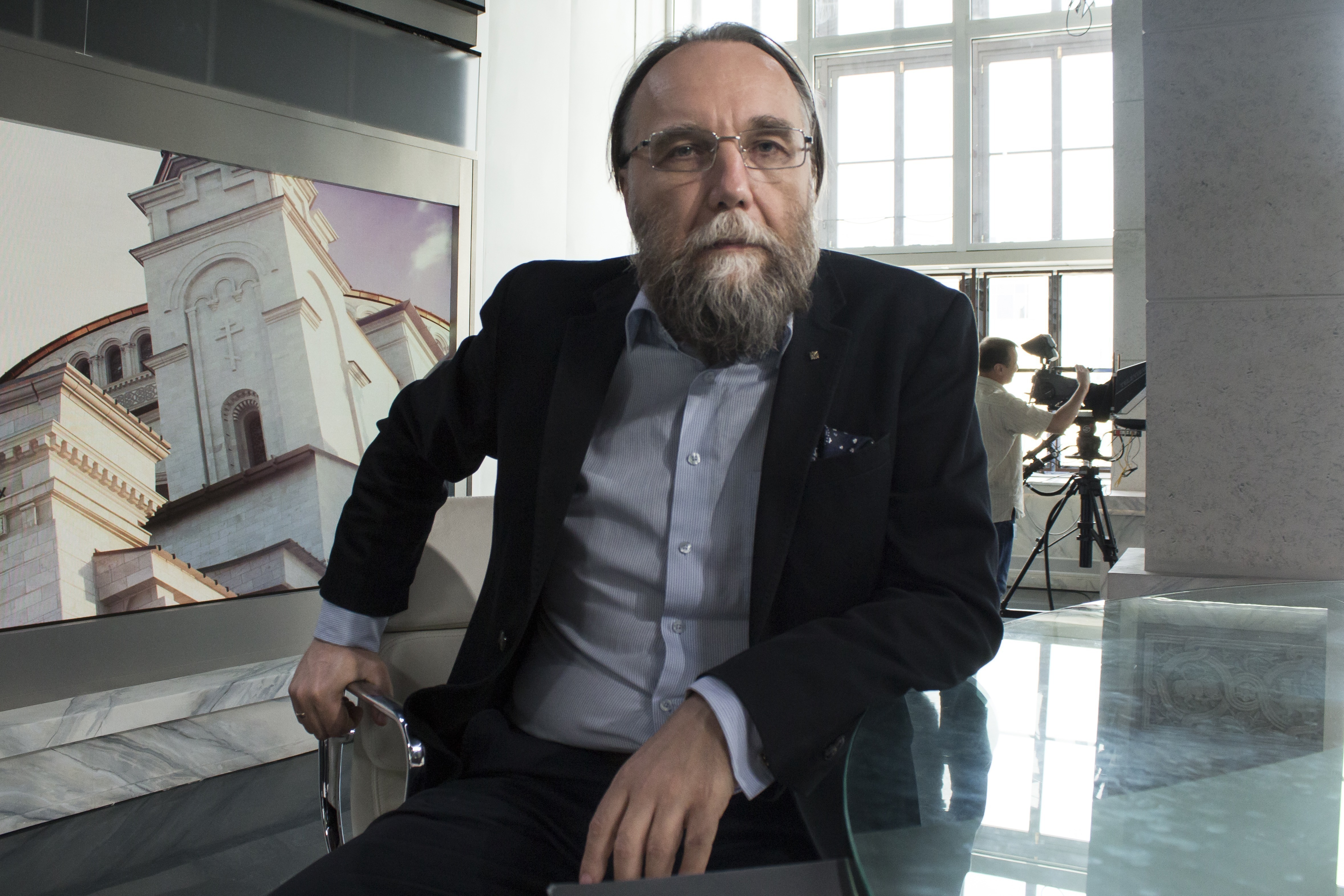 In this photo taken on Aug. 11, 2016, Alexander Dugin, the neo-Eurasianist ideologue, sits in his TV studio in central Moscow, Russia. The daughter of this Russian nationalist ideologist who is often referred to as “Putin's brain,” was killed when her car exploded on the outskirts of Moscow, officials said Sunday.