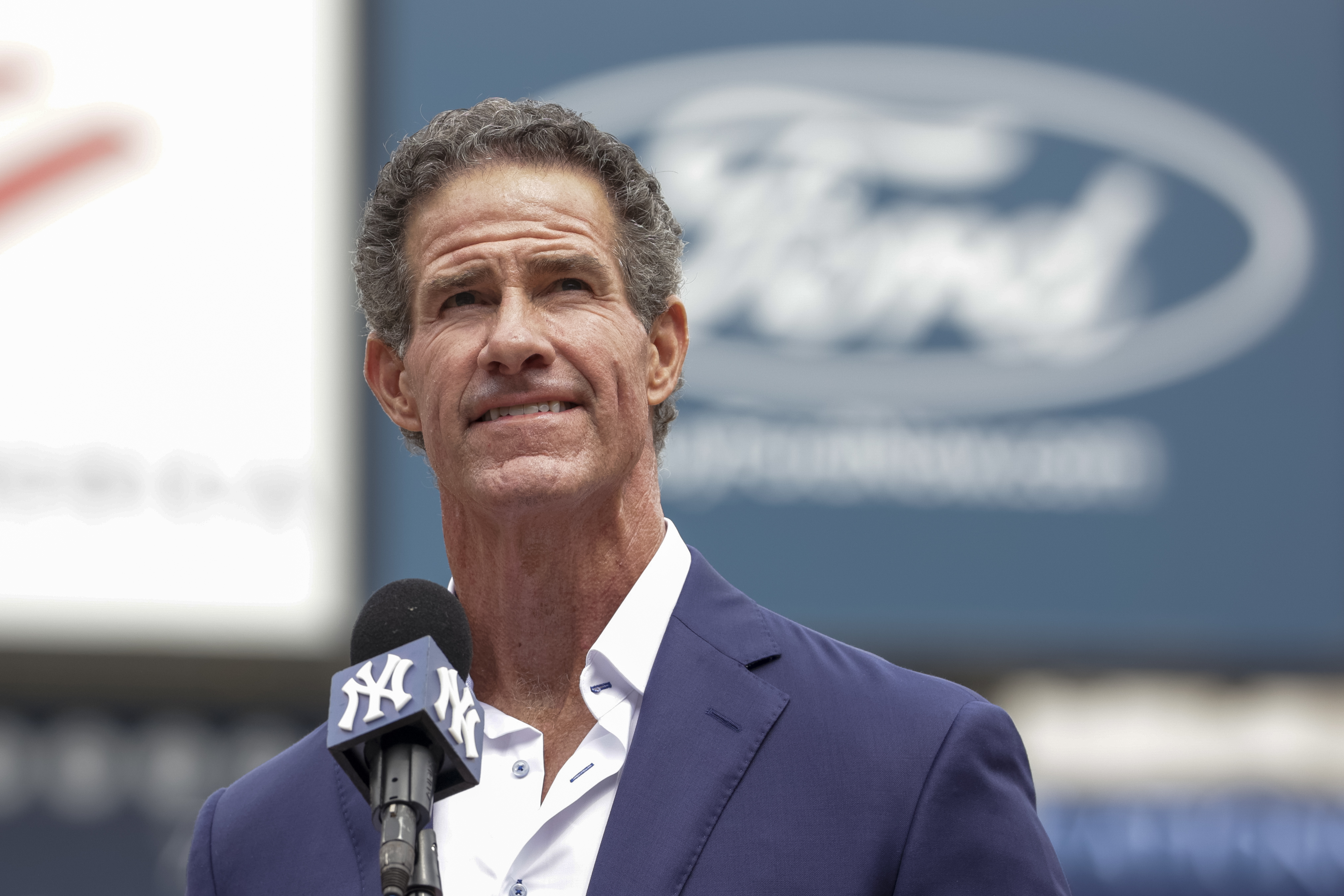 Retired New York Yankees player Paul O'Neill speaks to fans during a number retirement ceremony before a baseball game between the Yankees and the Toronto Blue Jays, Sunday, Aug. 21, 2022, in New York. 