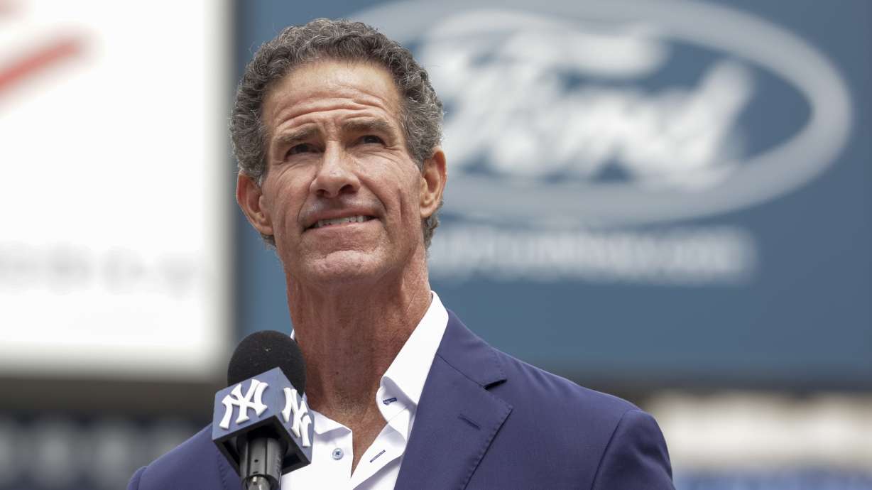 Retired New York Yankees player Paul O'Neill speaks to fans during a number retirement ceremony before a baseball game between the Yankees and the Toronto Blue Jays, Sunday, Aug. 21, 2022, in New York.