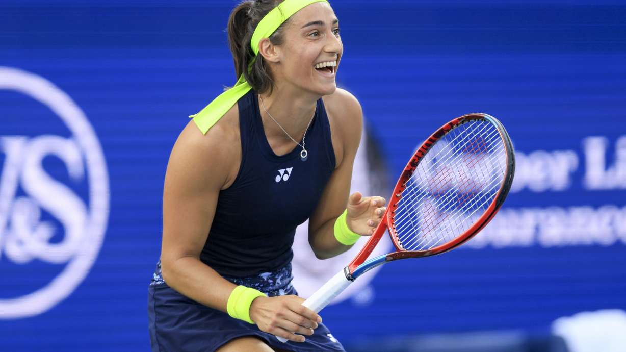 Caroline Garcia, of France, reacts as she defeats Petra Kvitova, of the Czech Republic, during the women's singles final of the Western & Southern Open tennis tournament, Sunday, Aug. 21, 2022, in Mason, Ohio.