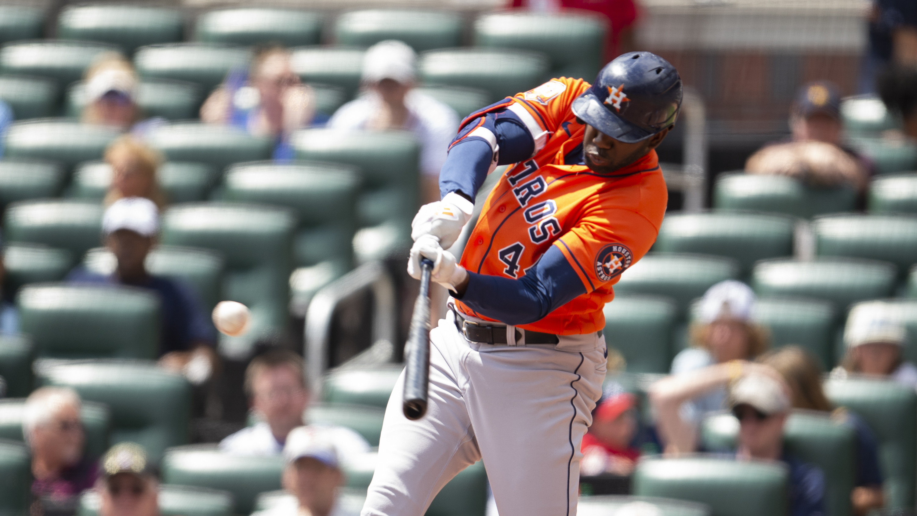 Houston Astros' Yordan Alvarez hits a single and scores Chas McCormick and Mauricio Dubon in the third inning of a baseball game against the Atlanta Braves Sunday, Aug. 21, 2022, in Atlanta. 