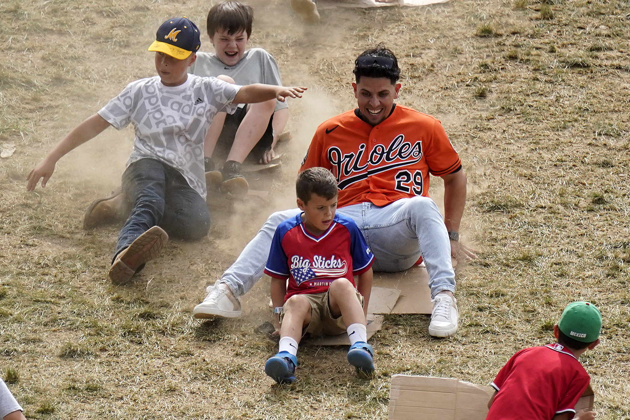 Baltimore Orioles' Ramon Urias (29) slides down the outfield hill overlooking Lamade Stadium during a visit to the Little League World Series in South Williamsport, Pa., Sunday, Aug. 21, 2022. The Orioles play the Boston Red Sox in the Little League Classic on Sunday Night Baseball. 