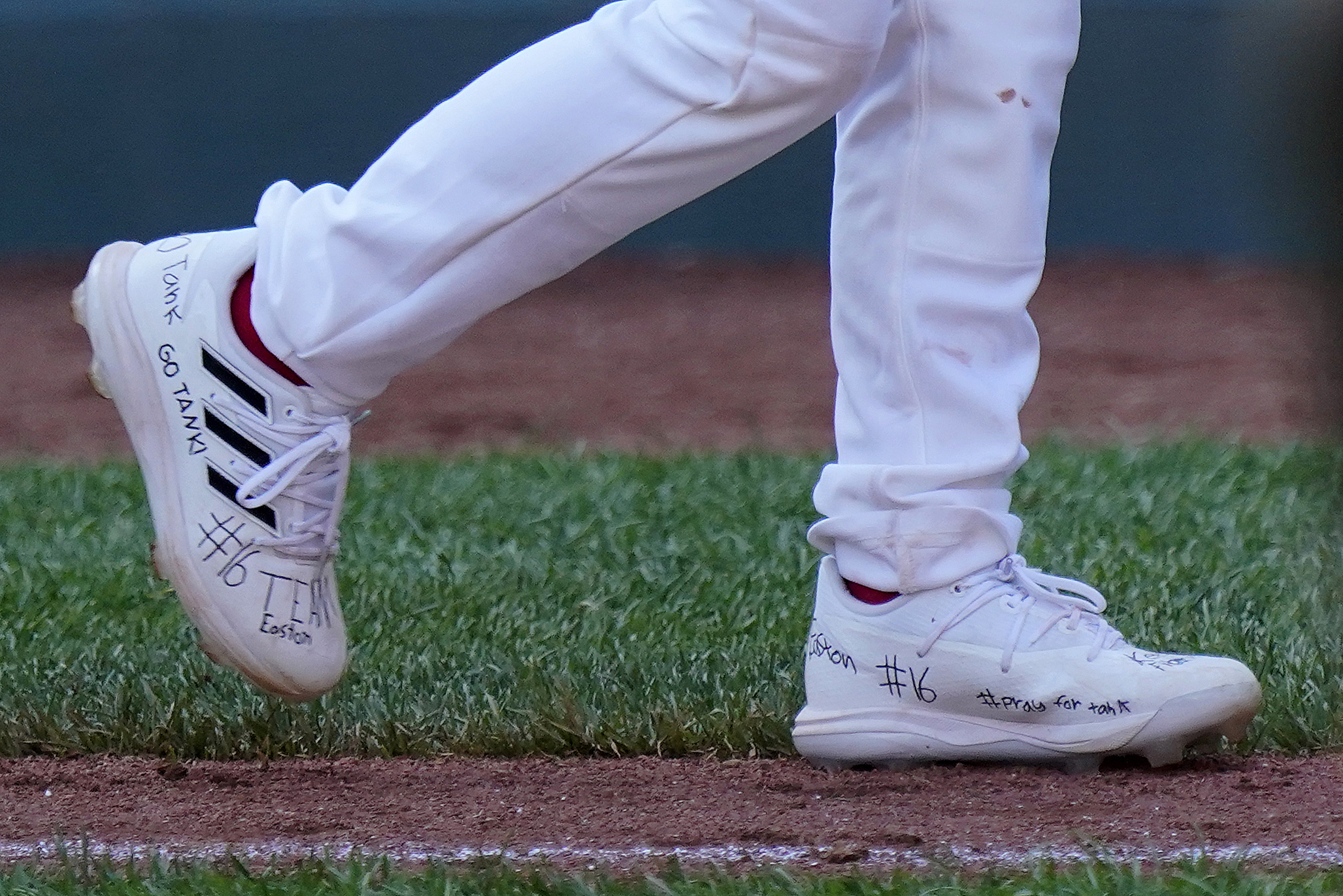 Utah's Brogan Oliverson has writing on his shoes in support of his brother Easton, who was injured when he fell out of his bunk, following a baseball game in which Brogan took his brother's place at the Little League World Series in South Williamsport, Pa., Friday. Easton Oliverson was expected to fly back Tuesday to Utah.