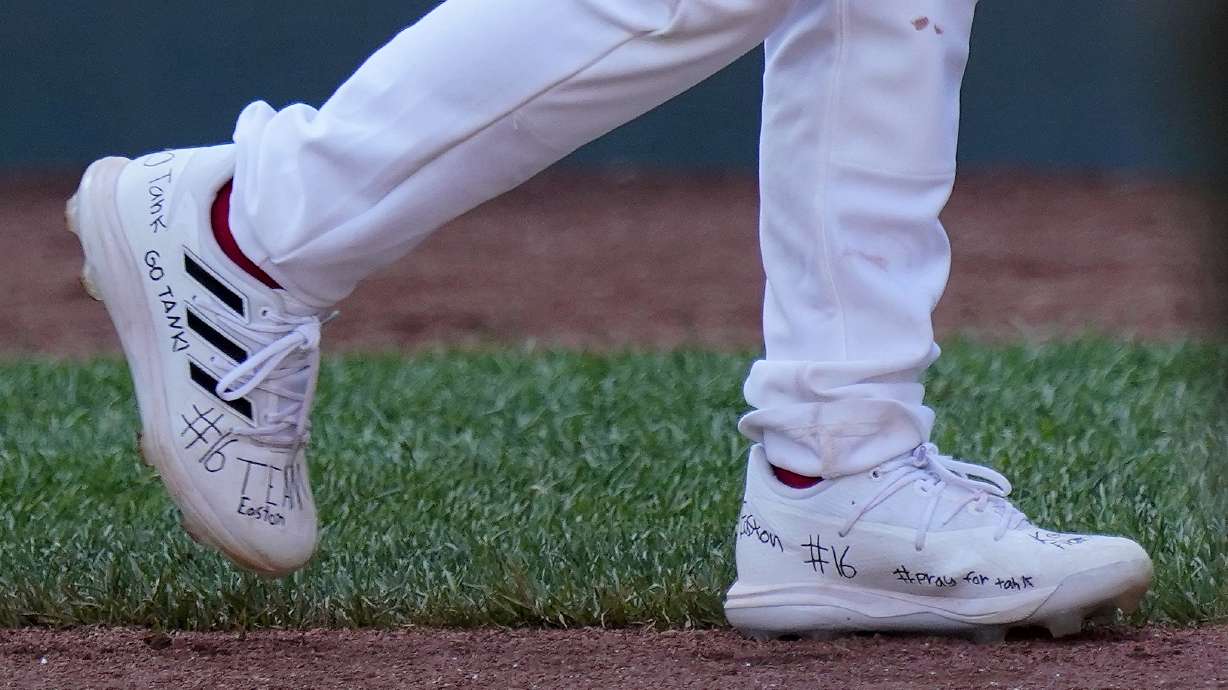 Utah's Brogan Oliverson has writing on his shoes in support of his brother Easton, who was injured when he fell out of his bunk, following a baseball game in which Brogan took his brother's place at the Little League World Series in South Williamsport, Pa., Friday. Easton Oliverson was expected to fly back Tuesday to Utah.