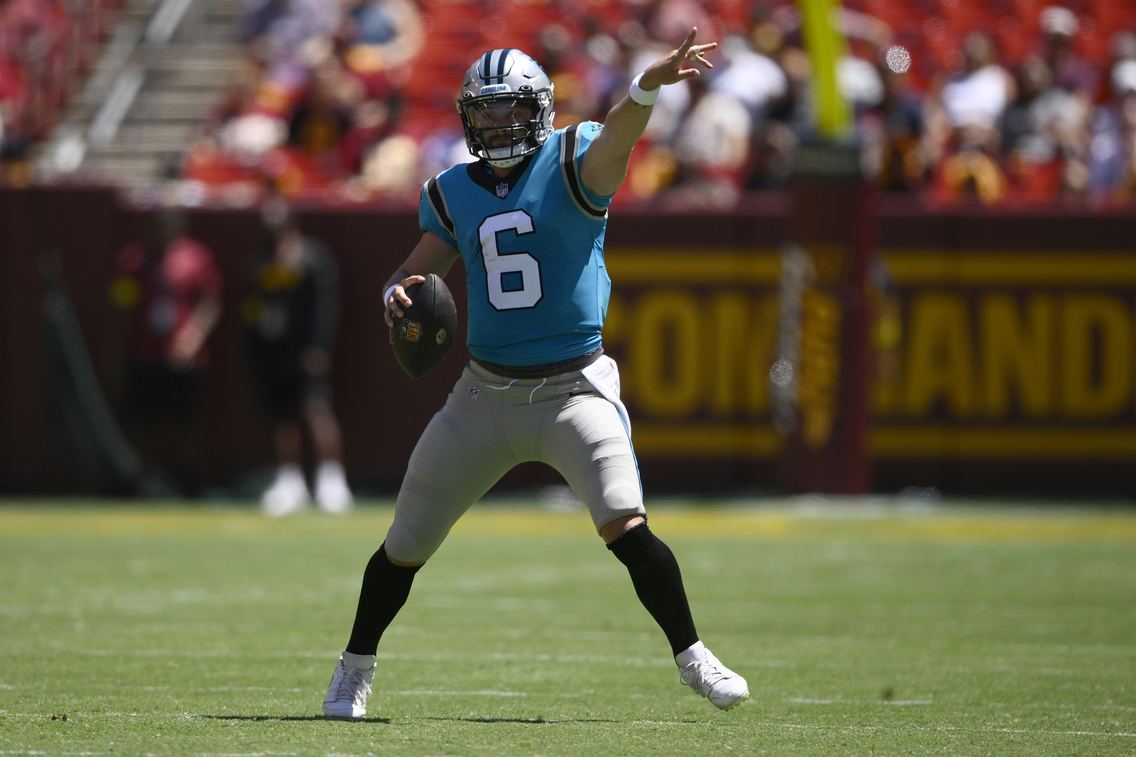 Carolina Panthers quarterback Baker Mayfield (6) gestures during the first half of a preseason NFL football game against the Washington Commanders, Saturday, Aug. 13, 2022, in Landover, Md. 