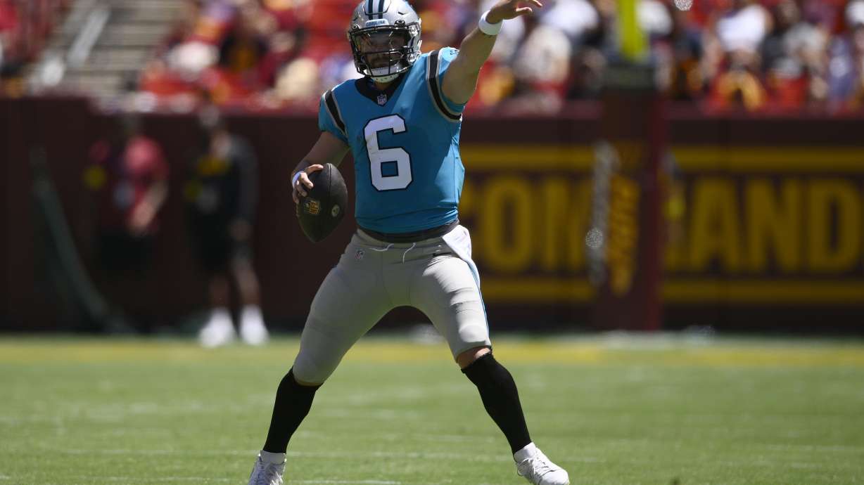 Carolina Panthers quarterback Baker Mayfield (6) gestures during the first half of a preseason NFL football game against the Washington Commanders, Saturday, Aug. 13, 2022, in Landover, Md.