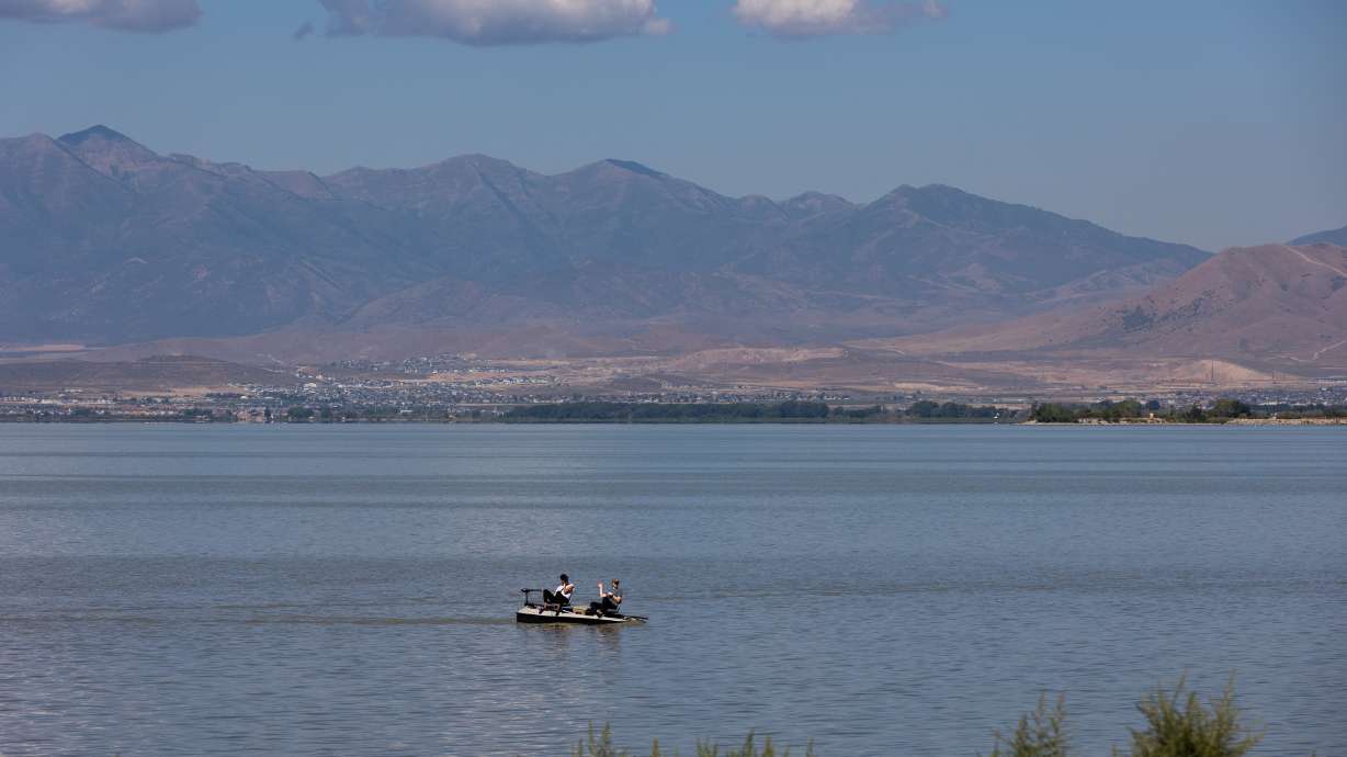 Boaters float along the Utah Lake by the Lindon Marina in Lindon on Aug. 22, 2022. Utah lawmakers approved two bills Friday, one repealing the Utah Lake Restoration Act and another calling for a study to improve flow from it to the Great Salt Lake.