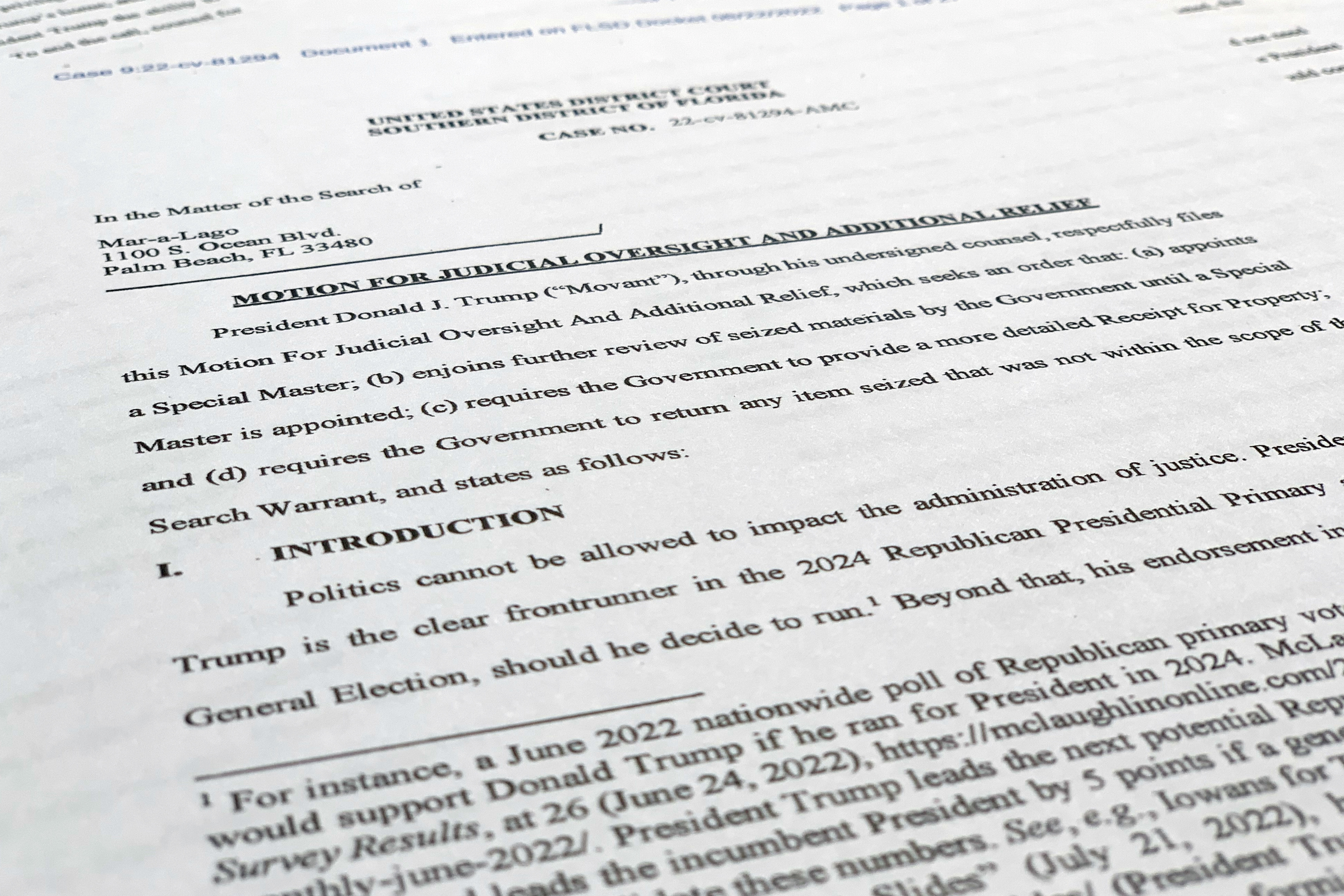 A court filing by lawyers for former President Donald Trump is photographed Monday, as lawyers ask a federal judge to prevent the FBI from continuing to review documents recovered from his Florida estate until a neutral special master can be appointed.