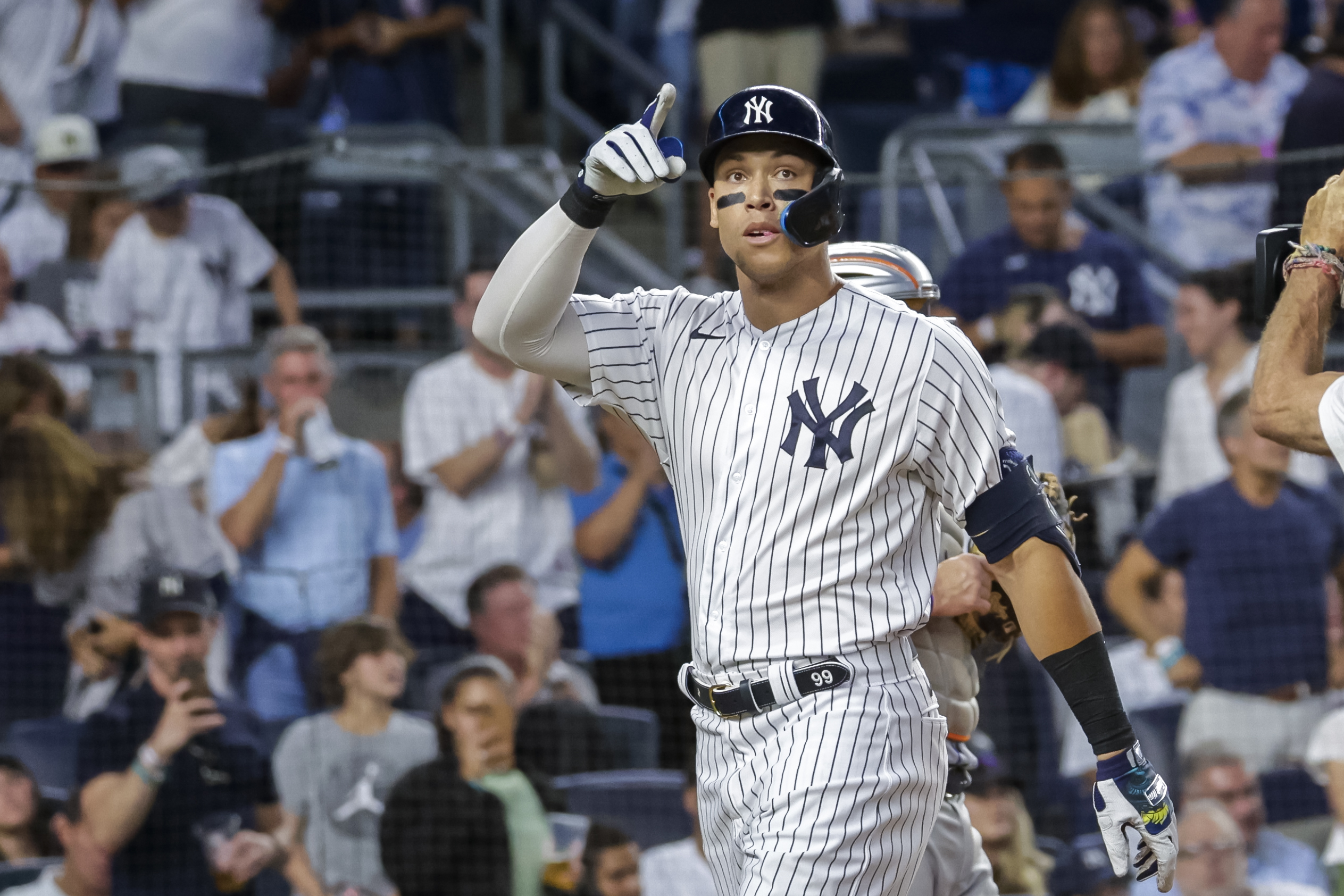 New York Yankees' Aaron Judge celebrates a home run in the third inning of a baseball game against the New York Mets, Monday, Aug. 22, 2022, in New York. 
