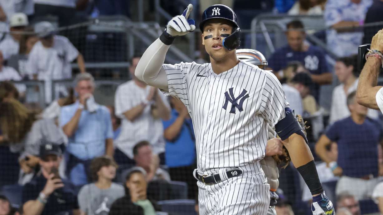 New York Yankees' Aaron Judge celebrates a home run in the third inning of a baseball game against the New York Mets, Monday, Aug. 22, 2022, in New York.