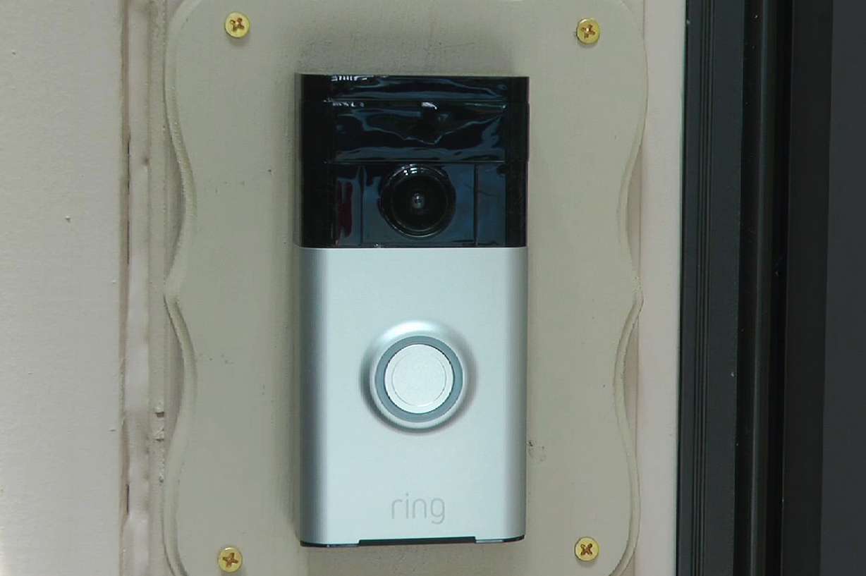In this June 28, 2019, image made from video, a Ring doorbell camera is shown at a home in Coon Rapids, Minn. From what you buy online, to how you remember tasks, to when you monitor your doorstep, Amazon is seemingly everywhere.