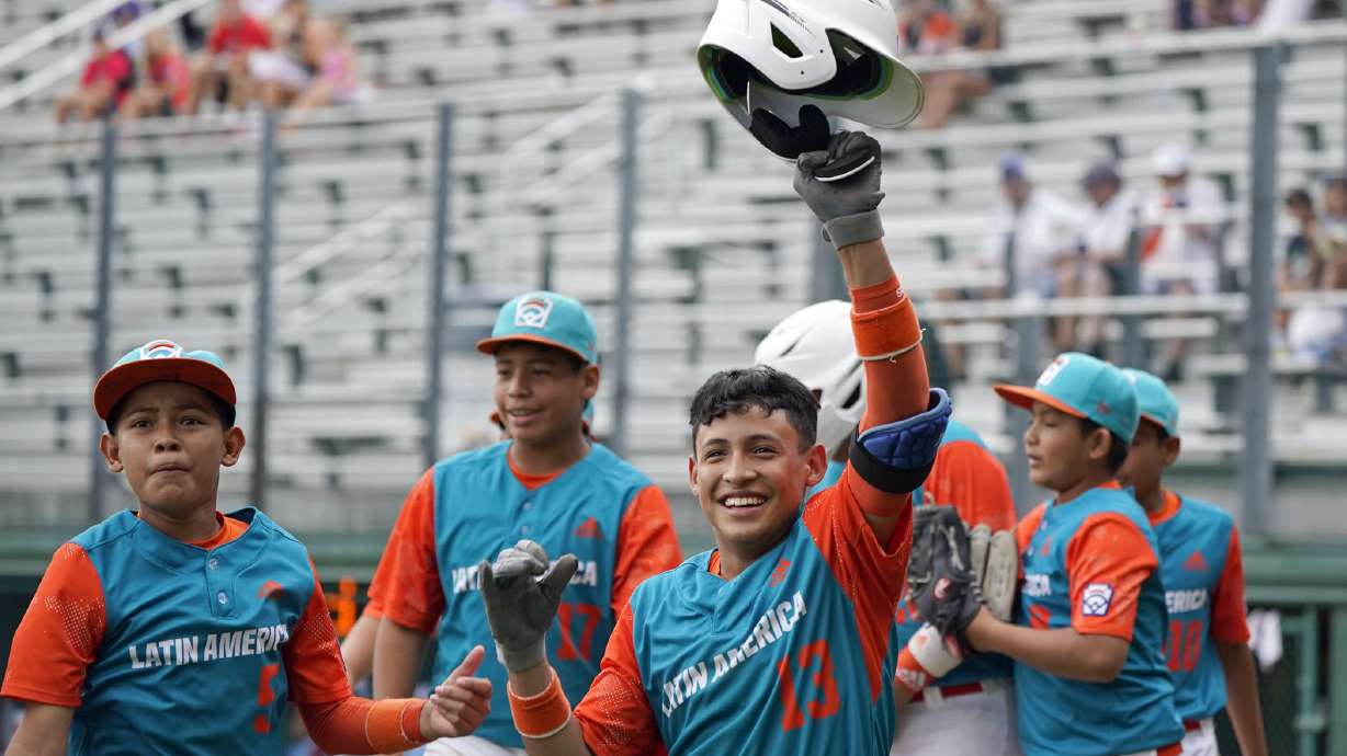 Nicaragua's Luis Garcia (13) celebrates on the way back to the dugout after his three run home run off of Panama pitcher Gabriel de Gracia during the fourth inning of a baseball game at the Little League World Series tournament in South Williamsport, Pa., Tuesday, Aug. 23, 2022. Nicaragua won the game 8-1.