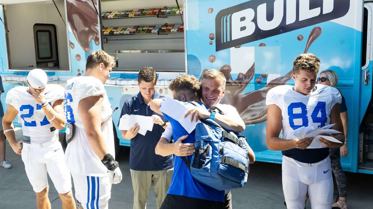 Built CEO and co-founder Nick Greer greets BYU football players after practice, Aug. 23, 2022 after it was announced that Built Brands has extended its partnership with the BYU football team for name, image and likeness rights.
