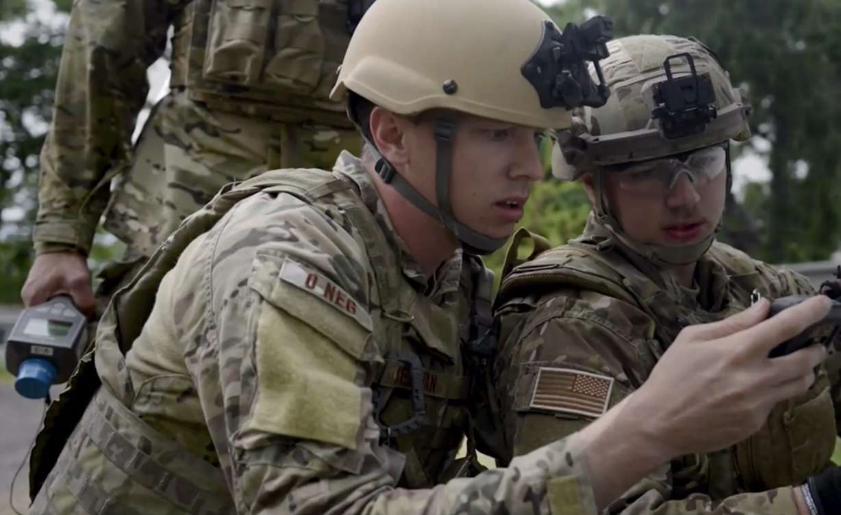 Tech Sgt. David Dezwaan, left, of Hill Air Force Base in this undated Department of Defense photo, is accused of making and detonating bombs at a U.S. military base in Syria. Dezwaan was in court Tuesday for a hearing that could lead to a court martial.