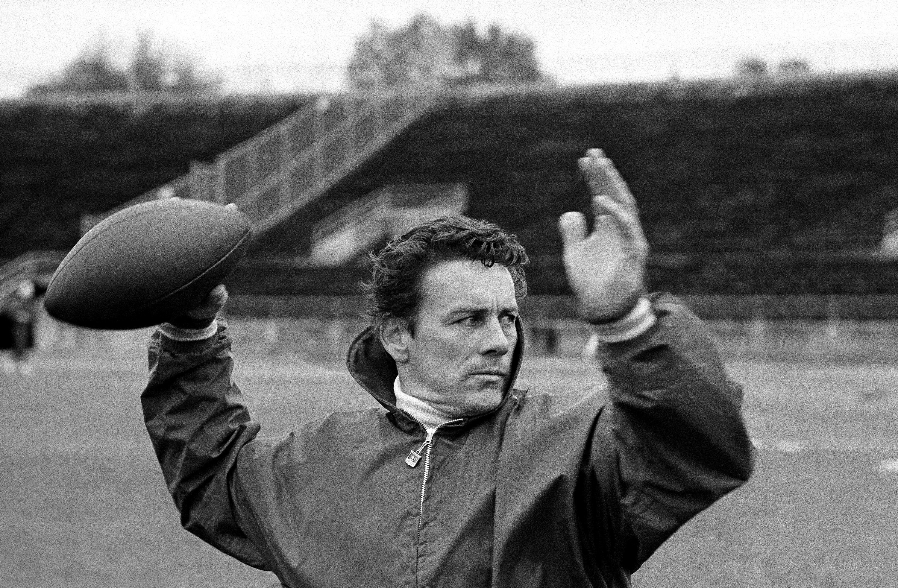 FILE -  Len Dawson of the Kansas City Chiefs running through passing drills with receivers in New Orleans to prepare for the Super Bowl, in January 1970. Dawson, the 87-year-old Hall of Fame quarterback who led the  Chiefs to their first Super Bowl title, has entered hospice care in Kansas City, Mo. KMBC-TV, the Kansas City station where Dawson began his broadcasting career in 1966, confirmed Dawson is in hospice care through his wife, Linda. 