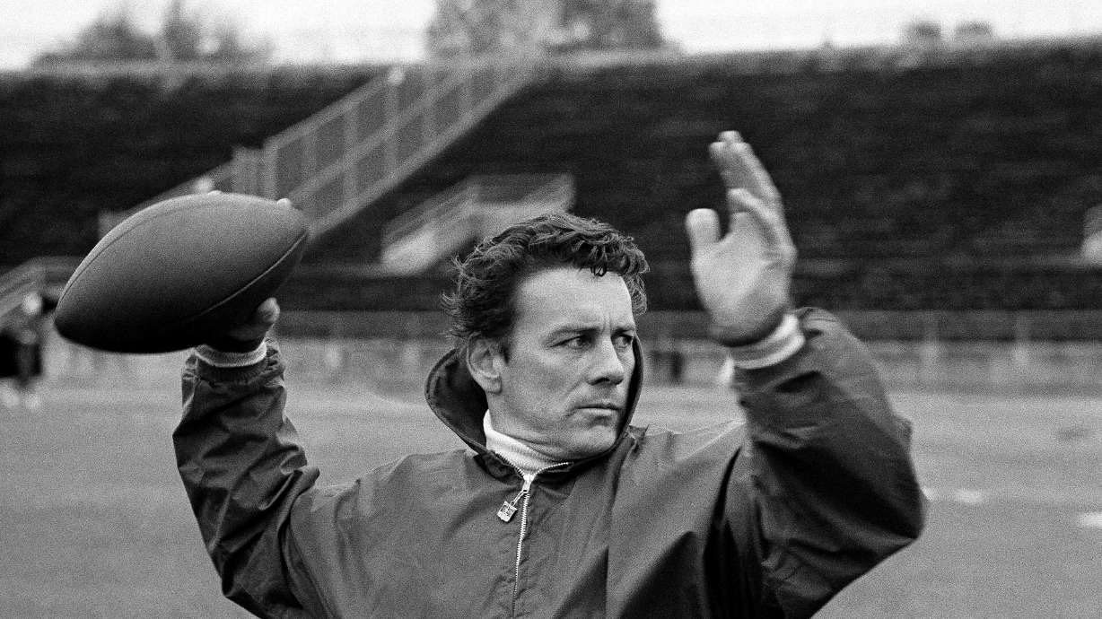 FILE - Len Dawson of the Kansas City Chiefs running through passing drills with receivers in New Orleans to prepare for the Super Bowl, in January 1970. Dawson, the 87-year-old Hall of Fame quarterback who led the Chiefs to their first Super Bowl title, has entered hospice care in Kansas City, Mo. KMBC-TV, the Kansas City station where Dawson began his broadcasting career in 1966, confirmed Dawson is in hospice care through his wife, Linda.