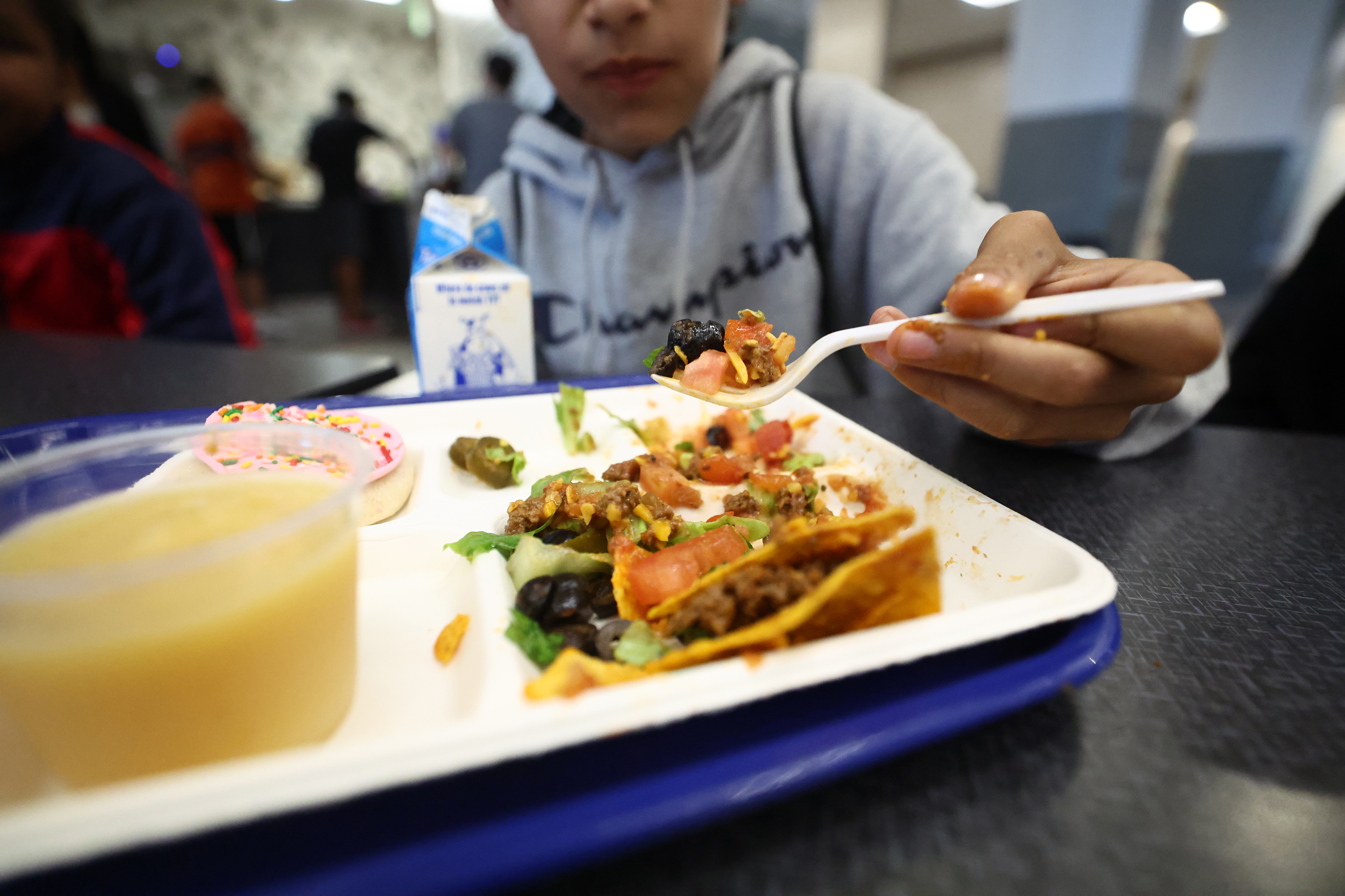 A student eats his lunch at Midvale Middle School on Tuesday, Aug. 16. California is the first state in the nation to provide free meals to all public school students, but what programs exist in Utah to assist students whose families may be unable to pay?