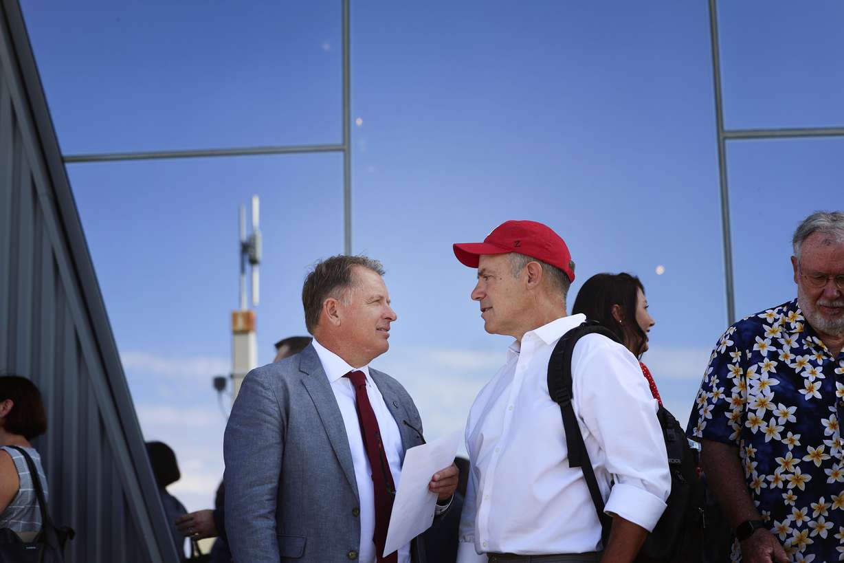 University of Utah President Taylor Randall and Clay Wilkes talk before a press conference at the Natural History Museum of Utah in Salt Lake City on Wednesday, announcing a $20 million gift from Wilkes and his wife to create a new Center for Climate Science and Policy.