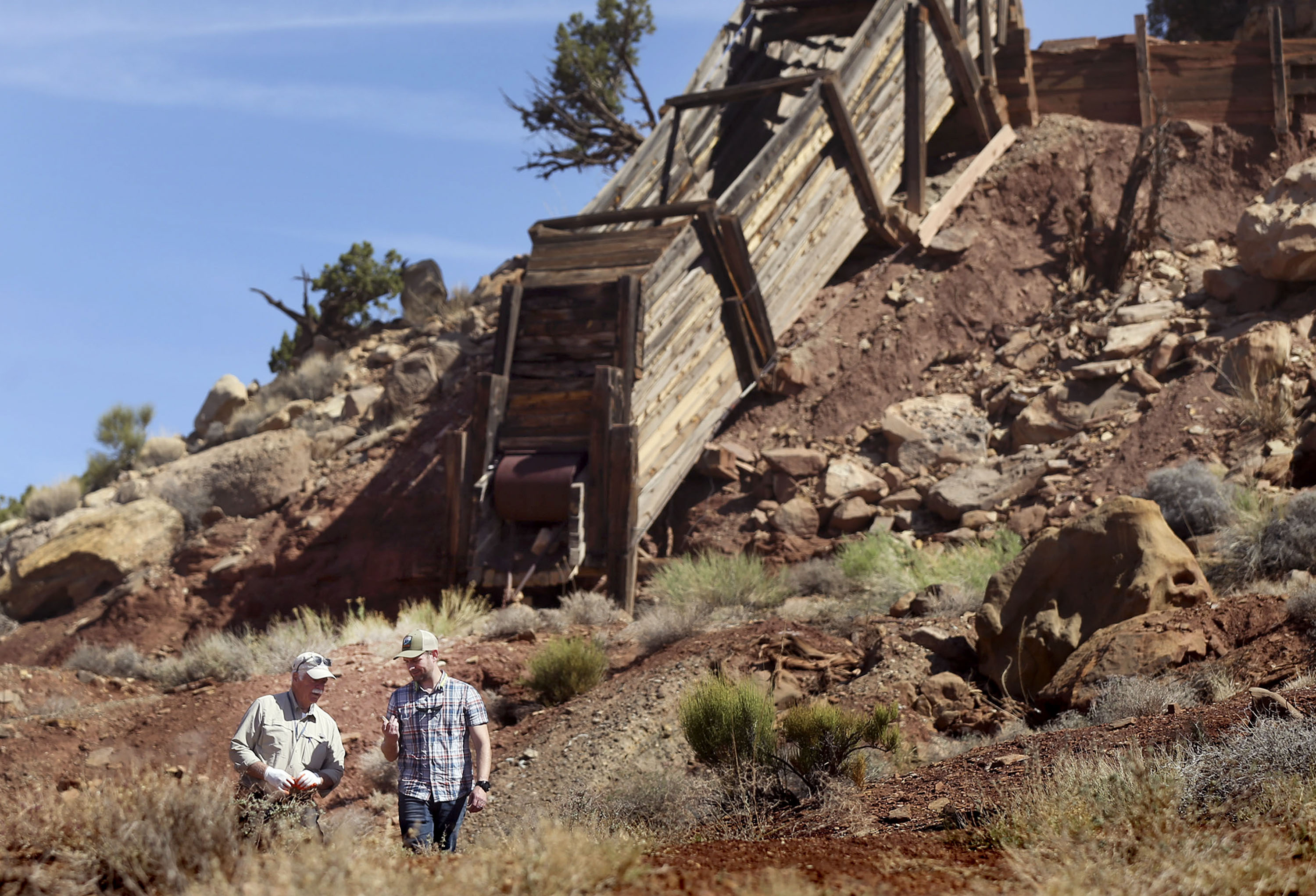 Dan Proctor and his son, Nick, survey their mining claim located in the Colt Mesa area of the former Grand Staircase-Escalante National Monument on May 14, 2021. The area contains grades of cobalt at higher concentrations than cobalt mines in the Democratic Republic of Congo. A powerful coalition of Utah politicians announced a lawsuit Wednesday challenging the Biden administration's designation of Bears Ears and Grand Staircase-Escalante national monuments.