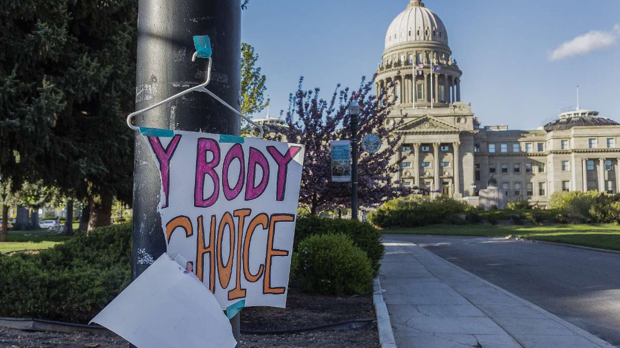 A sign reading "My body, my Choice," is taped to a hanger taped to a streetlight in front of the Idaho State Capitol Building on May 3. A federal judge has barred Idaho from enforcing a strict abortion ban in medical emergencies, clearing the way for hospitals to continue treating ectopic pregnancies and other pregnancy-related complications normally for now.