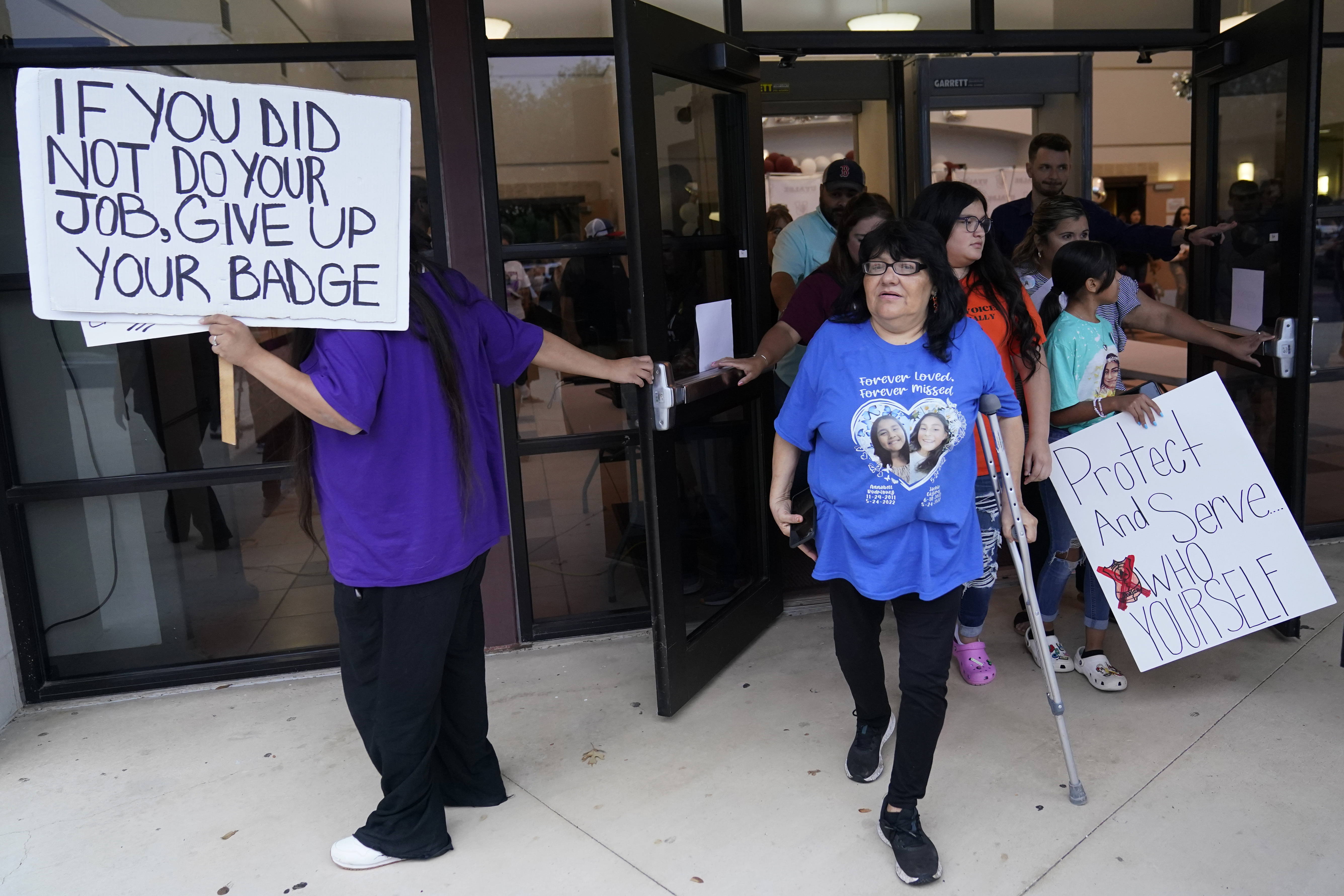 Family, parents and friends file out of a meeting where Uvalde School District Police Chief Pete Arredondo was dismissed by the Board of Trustees of the Uvalde Consolidated Independent School District, Wednesday in Uvalde, Texas.