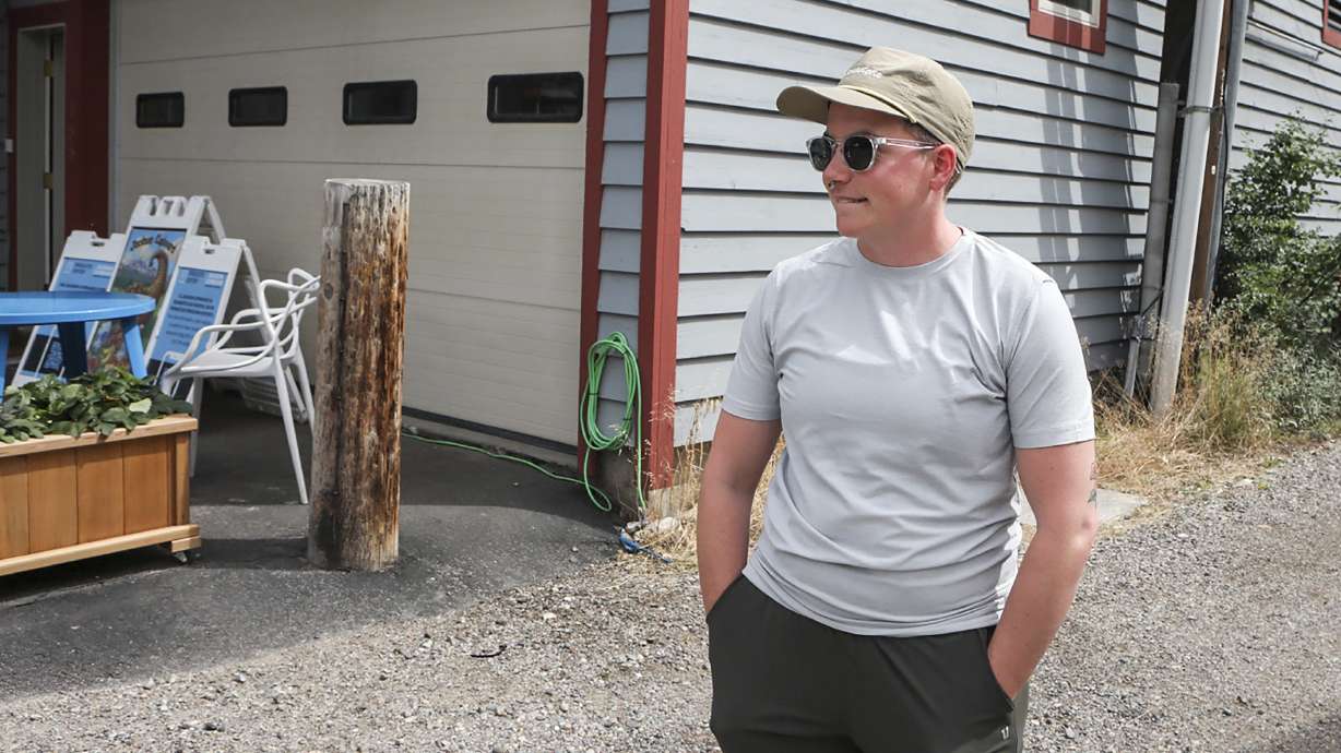 Ash Hermanowski, the food access and operations manager of the Jackson Cupboard, poses for a portrait on Wednesday, in Jackson Hole, Wyo. As the Federal Reserve's annual Jackson Hole economic symposium gets under way Thursday, some of the very problem federal officials are grappling with are all too visible.
