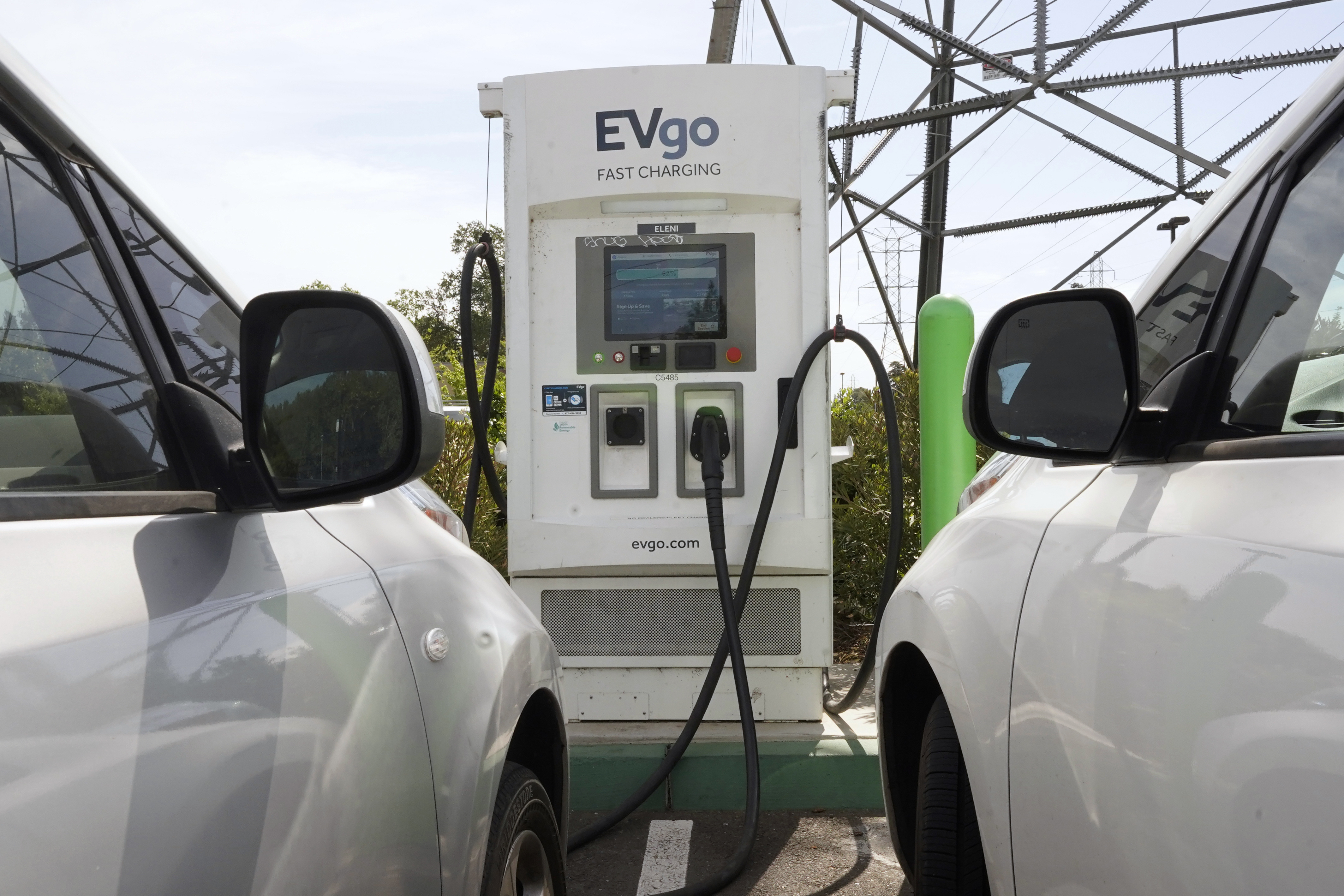 Electric cars are parked at a charging station in Sacramento, Calif., on April 13. California is poised to require 100% of new cars, trucks and SUVs sold in the state to be powered by electricity or hydrogen by 2035, a groundbreaking climate policy likely to reshape the U.S. car market by speeding the transition to electric vehicles.