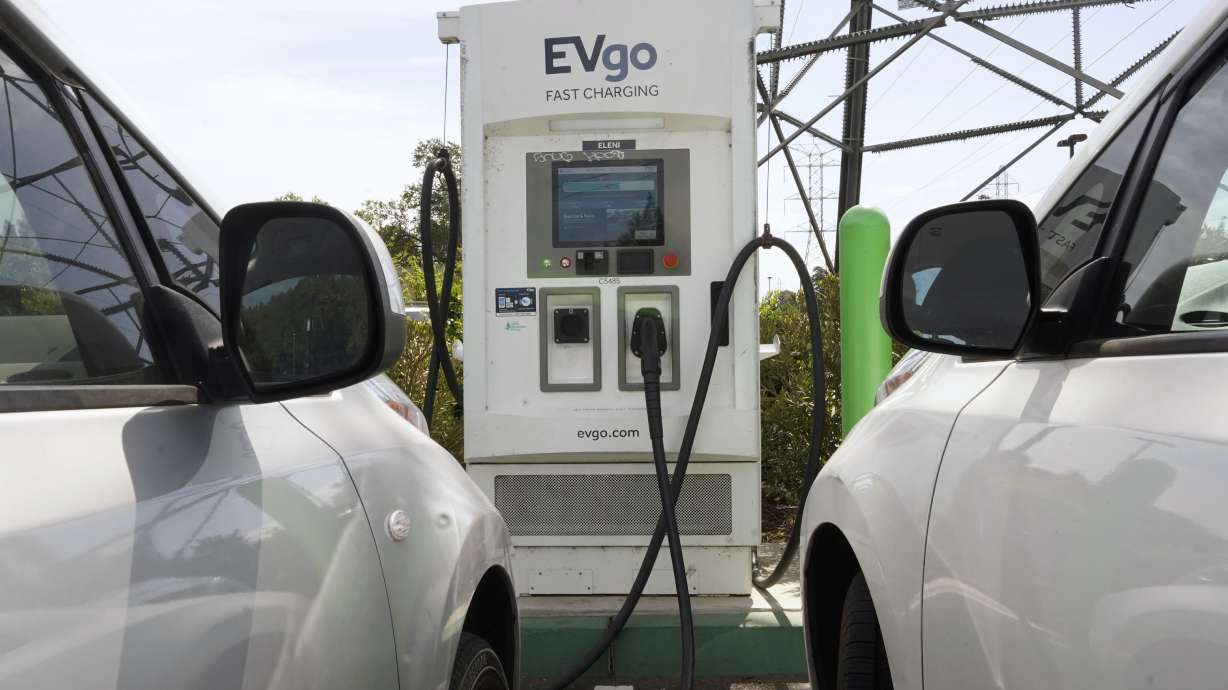 Electric cars are parked at a charging station in Sacramento, Calif., on April 13. California is poised to require 100% of new cars, trucks and SUVs sold in the state to be powered by electricity or hydrogen by 2035, a groundbreaking climate policy likely to reshape the U.S. car market by speeding the transition to electric vehicles.